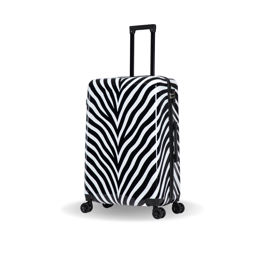 A hard-shell spinner suitcase with a bold black and white zebra print pattern, featuring an extended black telescoping handle and four multi-directional wheels, shown on a clean white background.