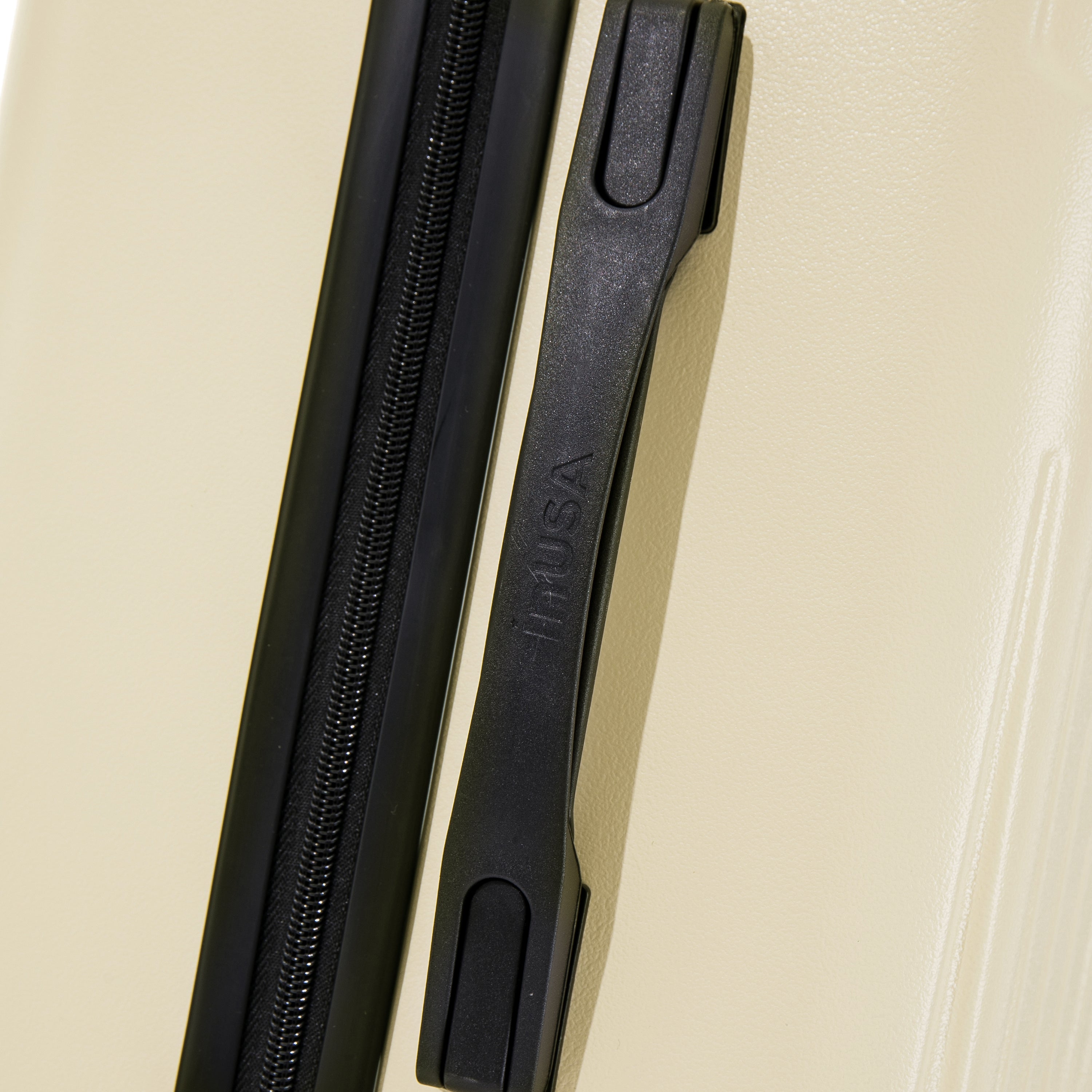 Black zipper on a beige background with 'Tita USA' branding.