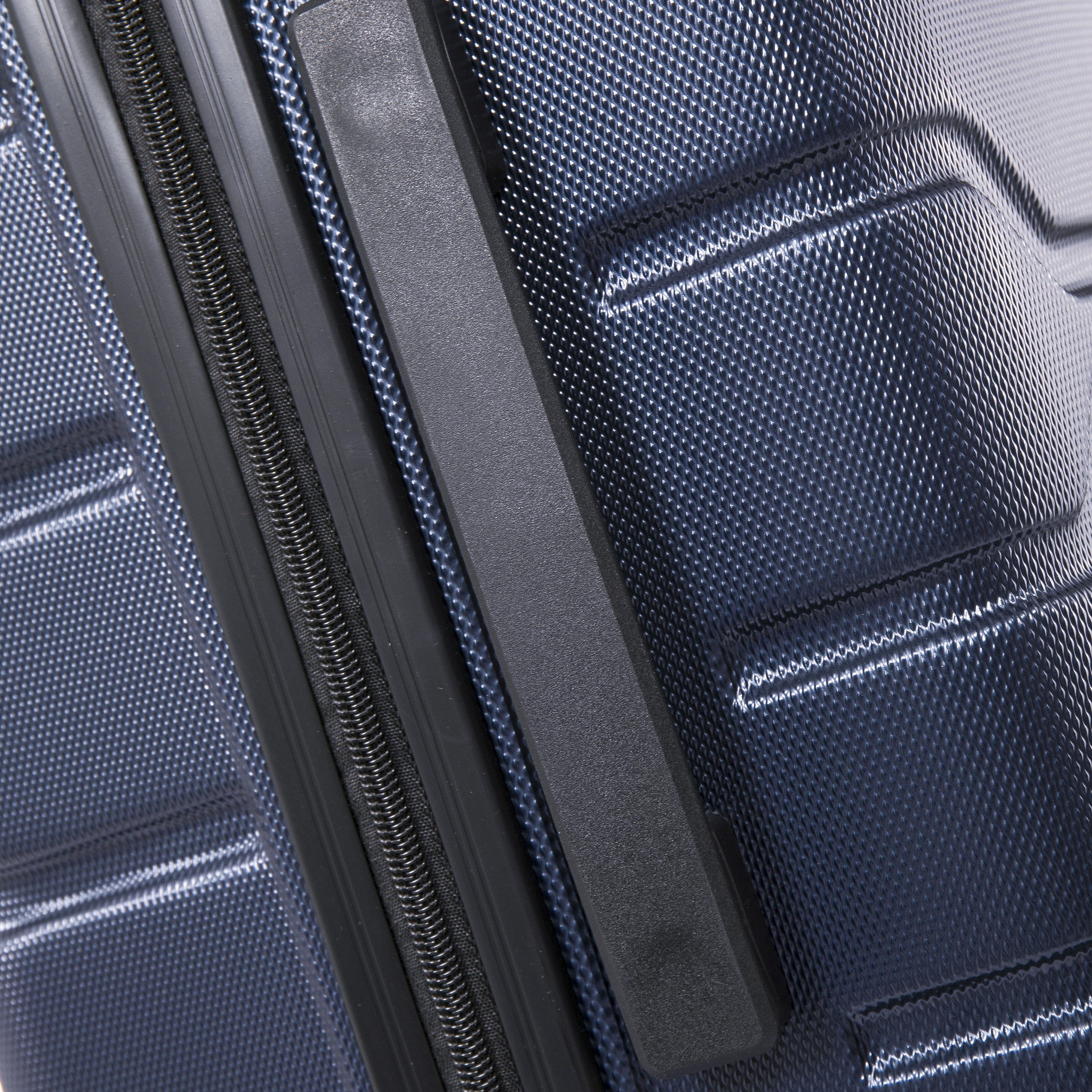 Close-up of a blue textured suitcase with a black handle