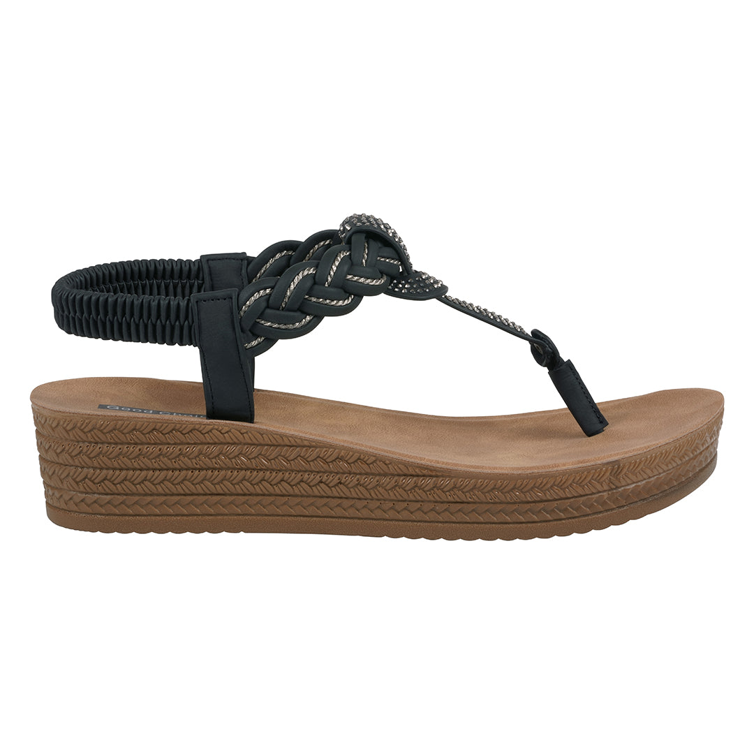 Black sandal with braided design on a white background