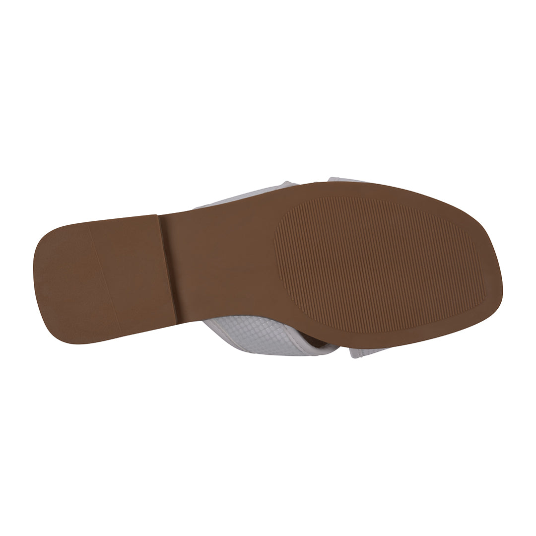 Brown sole of a shoe on a white background