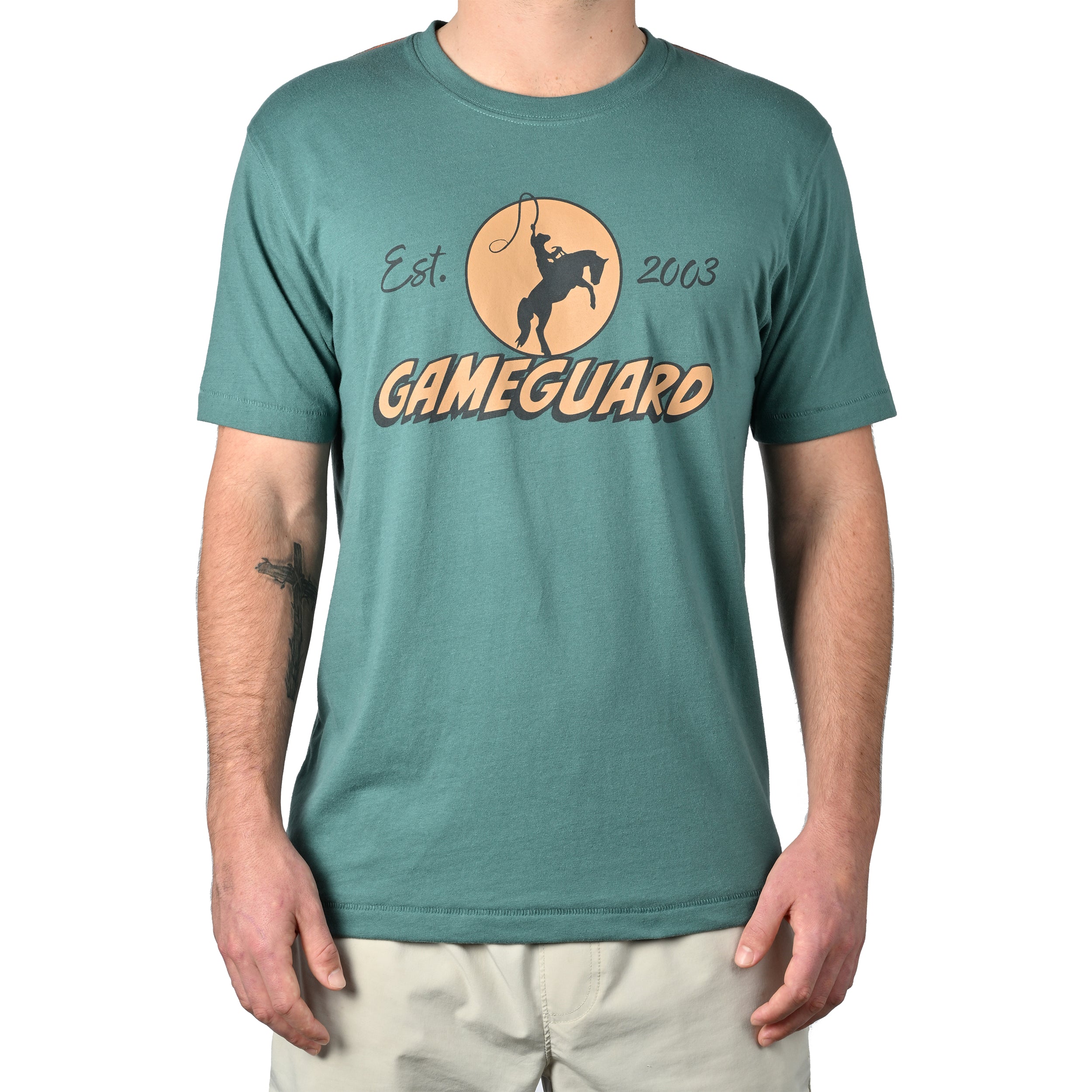 Teal t-shirt with 'Gameguard' logo worn by a person on a white background