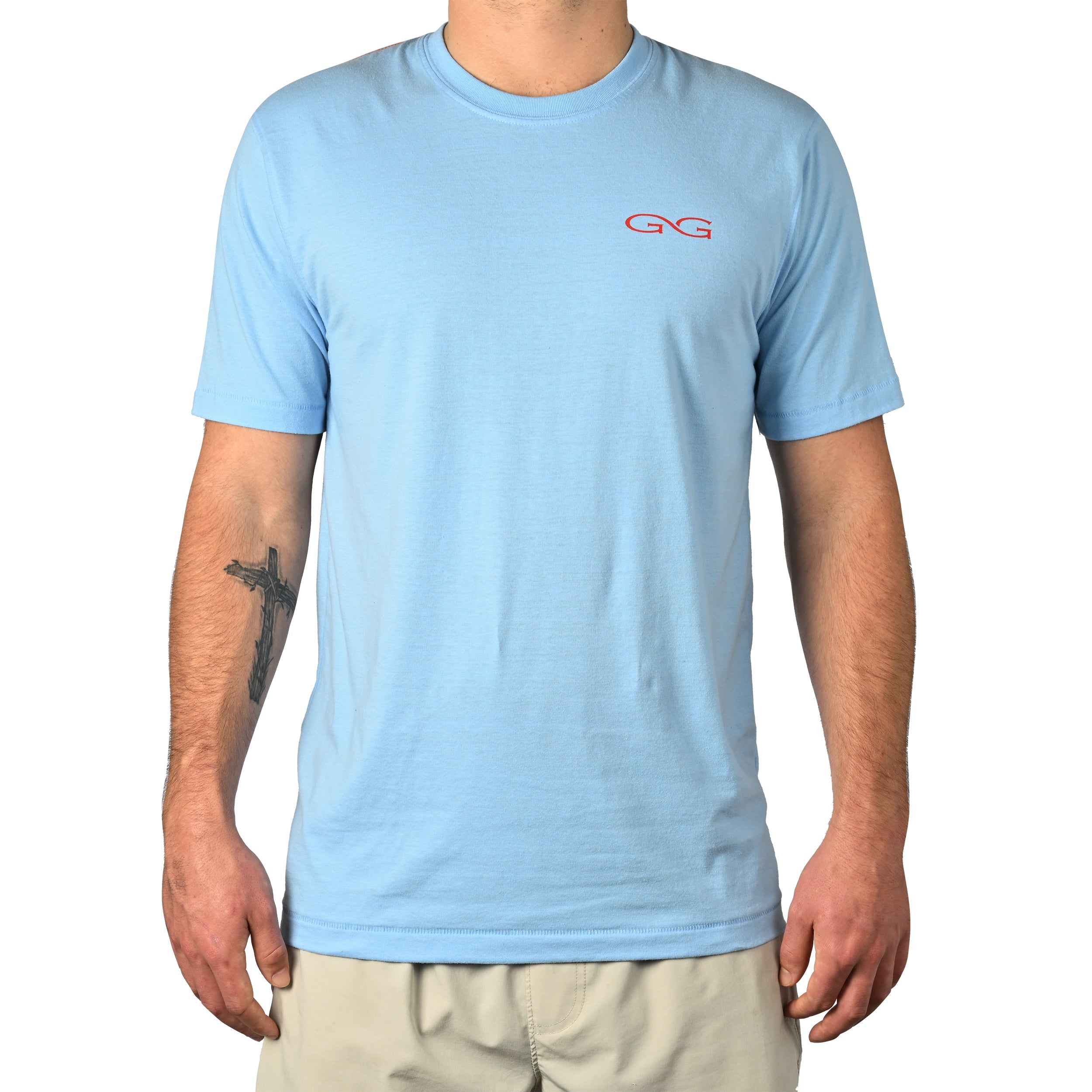 Light blue t-shirt with a logo worn by a person on a white background