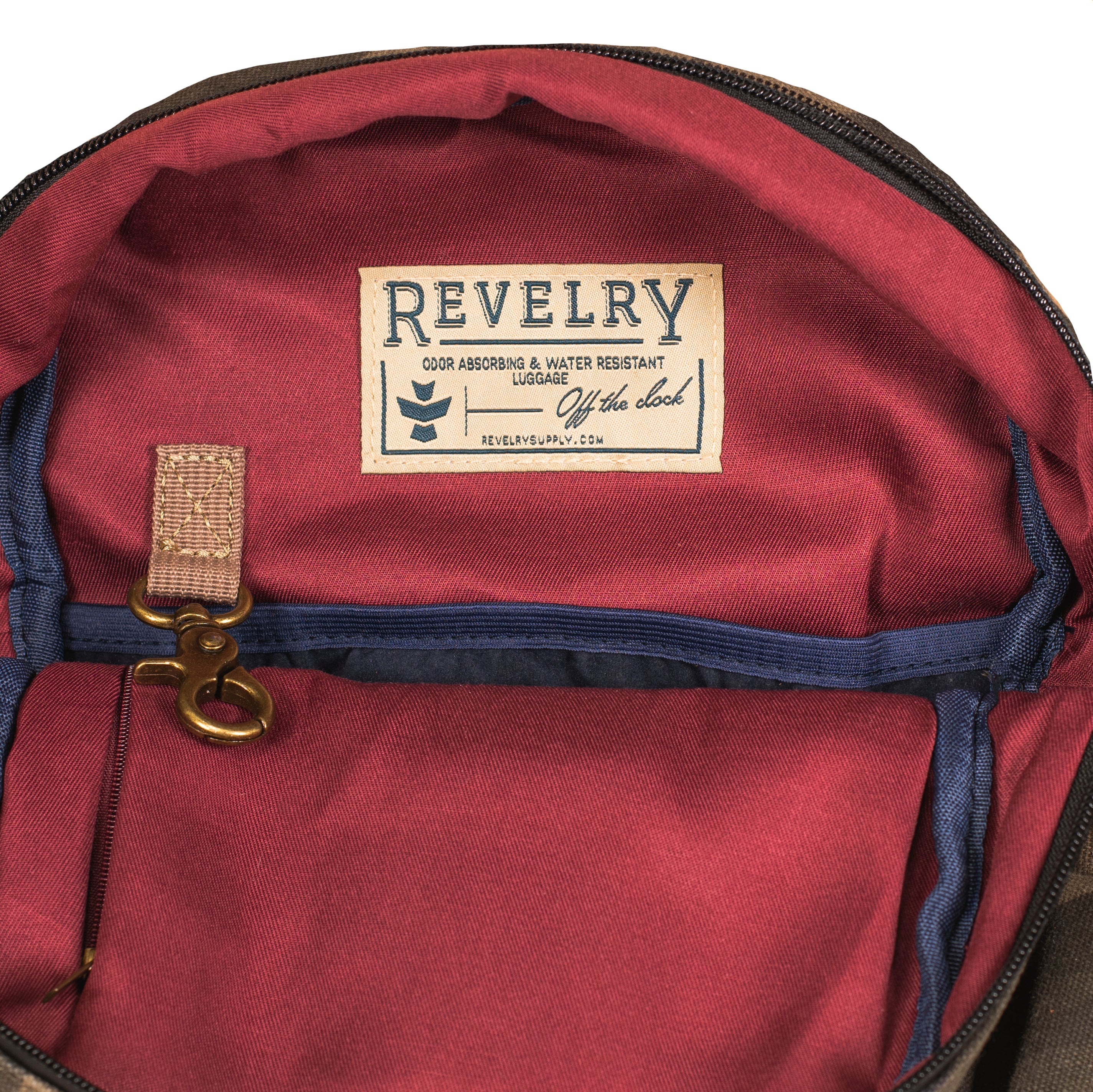 Red backpack with a 'Revelry' label on a white background