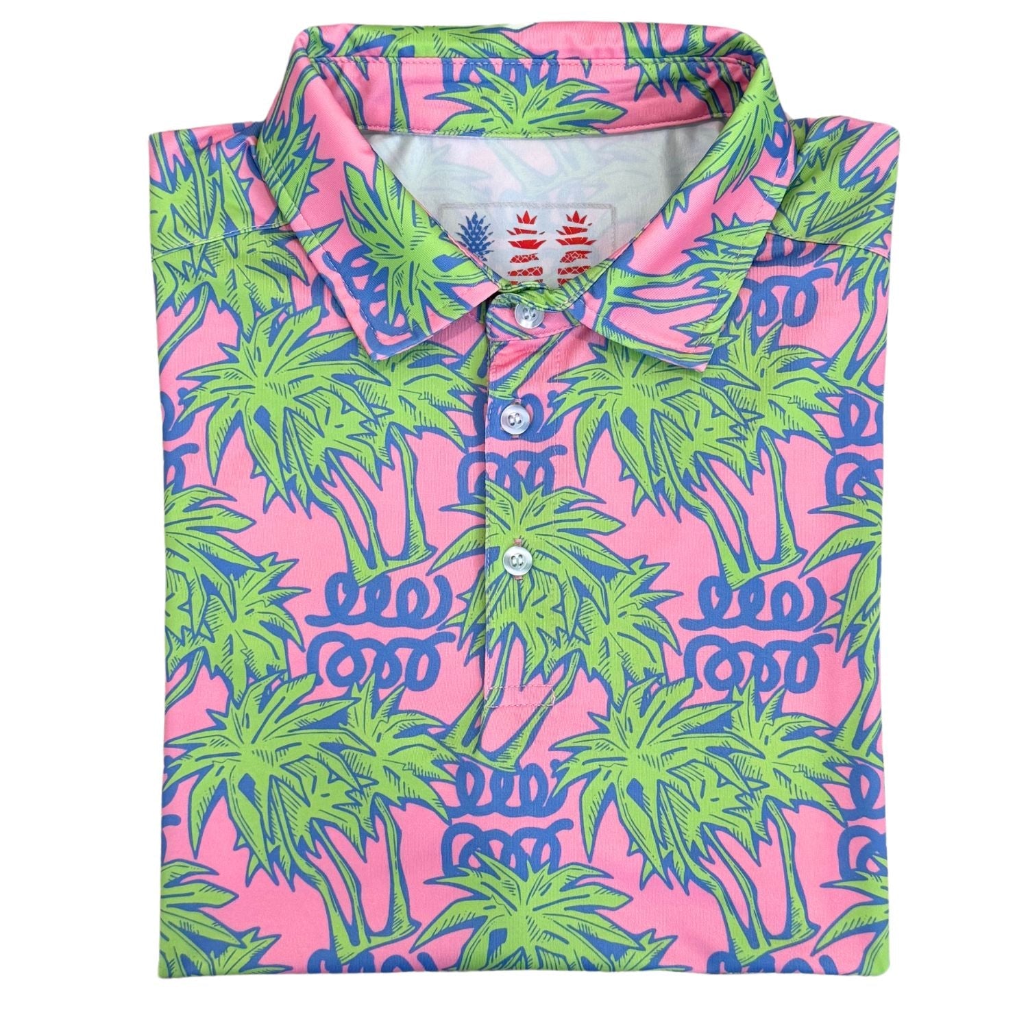 Folded pink shirt with green palm tree pattern on a white background
