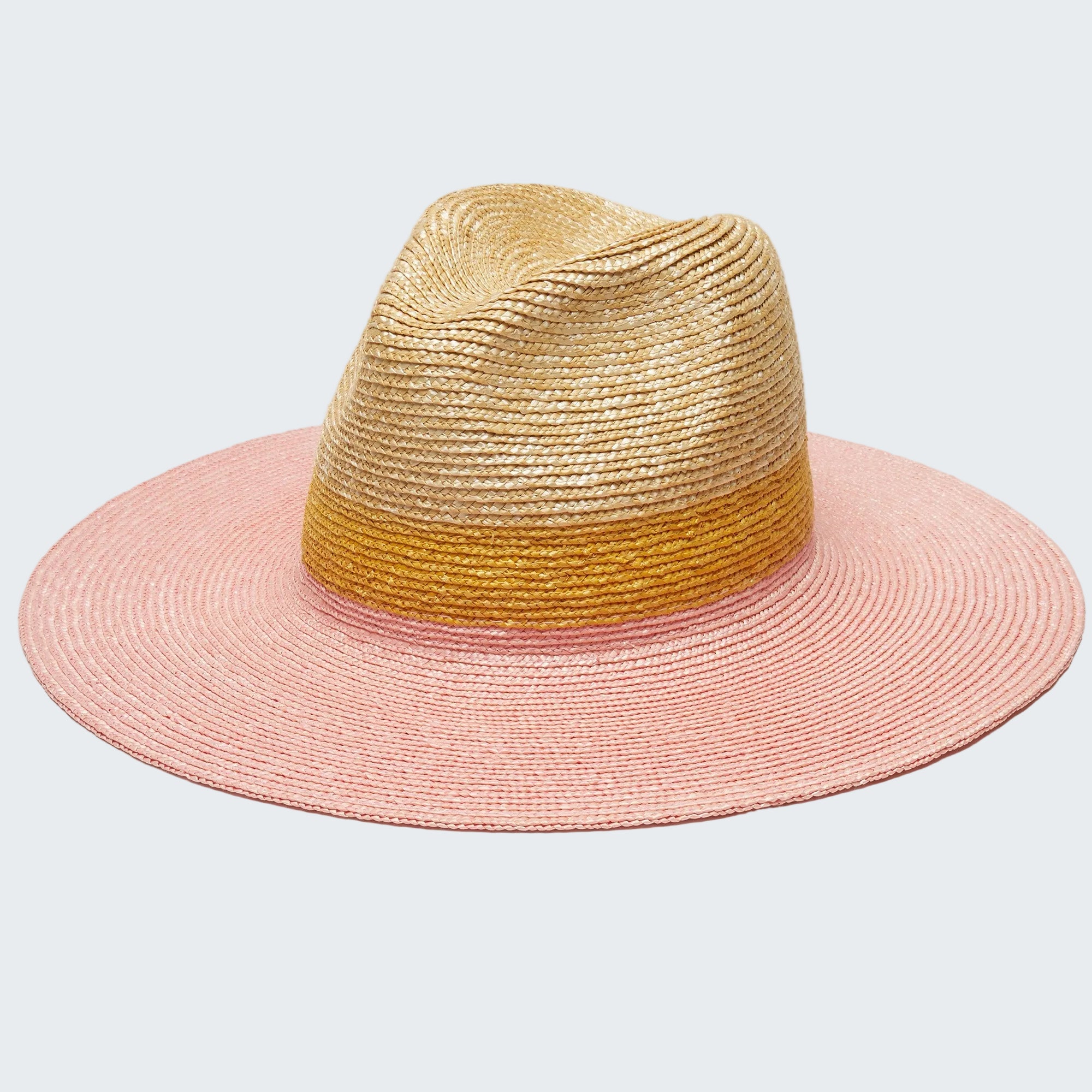 Two-toned straw hat with pink and gold colors on a white background