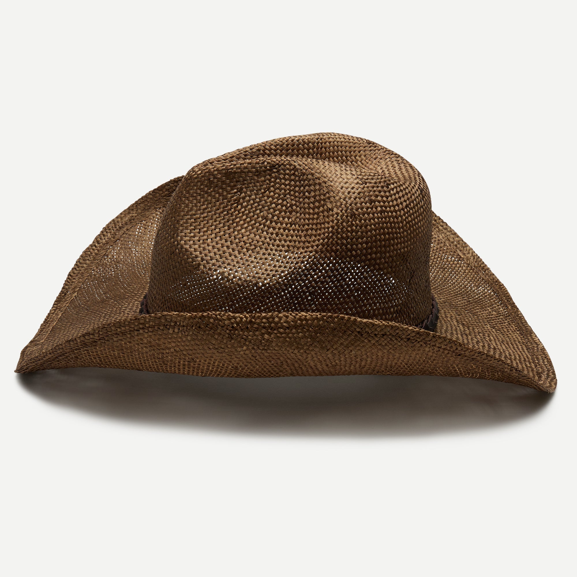 Brown straw cowboy hat on a white background