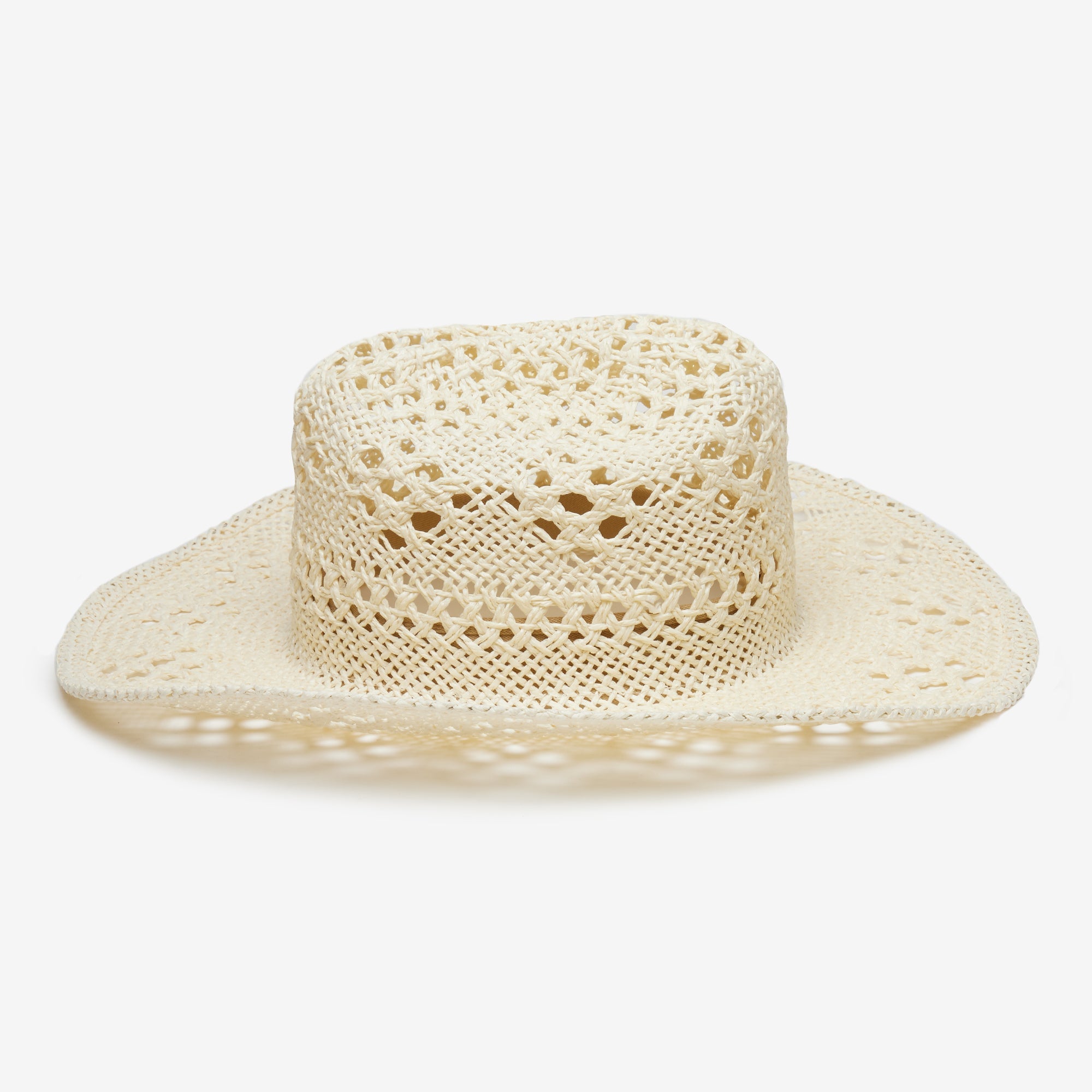 Beige crochet hat on a white background