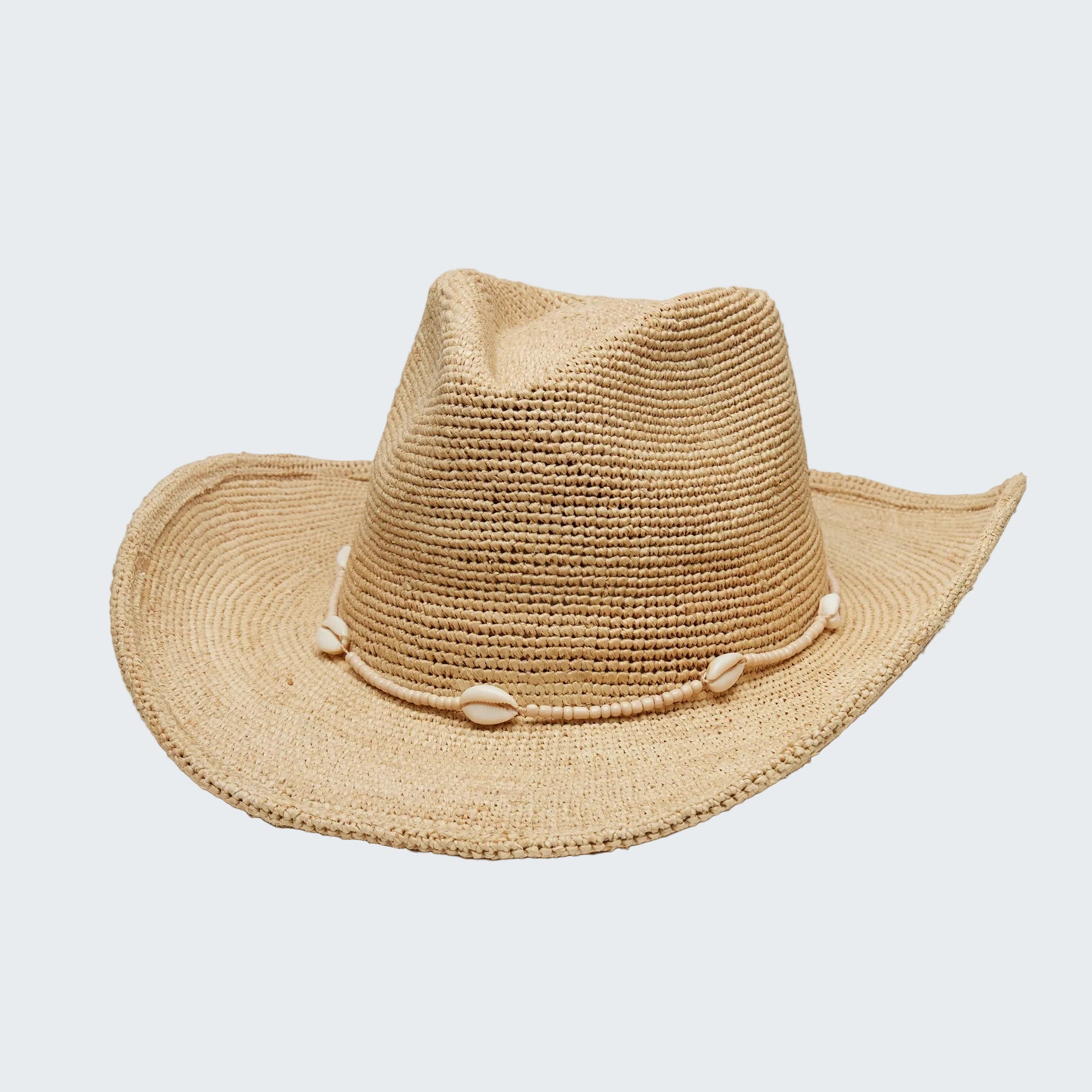 Beige straw hat with a wide brim on a light gray background