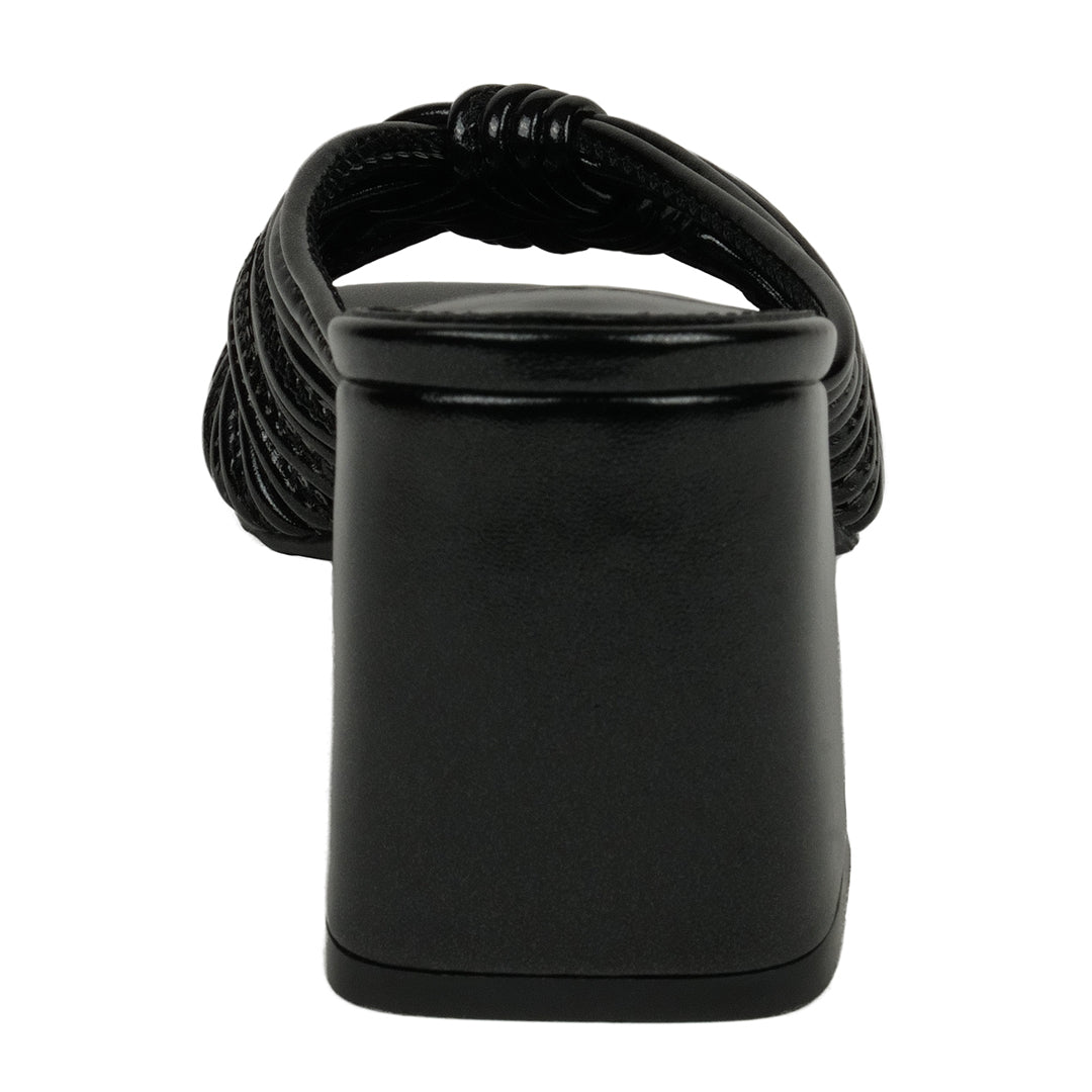 Black woven belt with a cylindrical black buckle on a white background