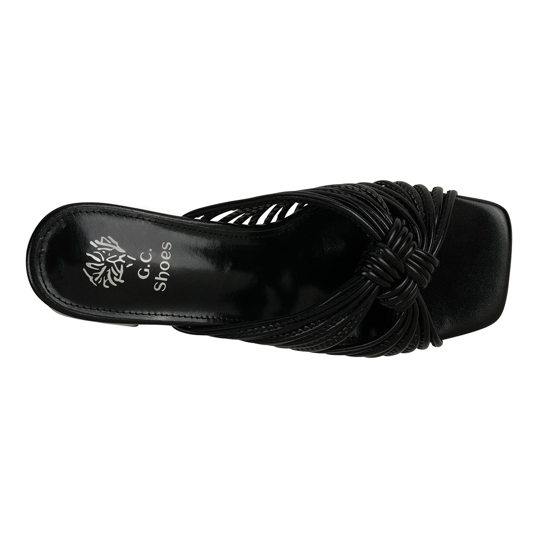 Black sandal with ruched design on a white background