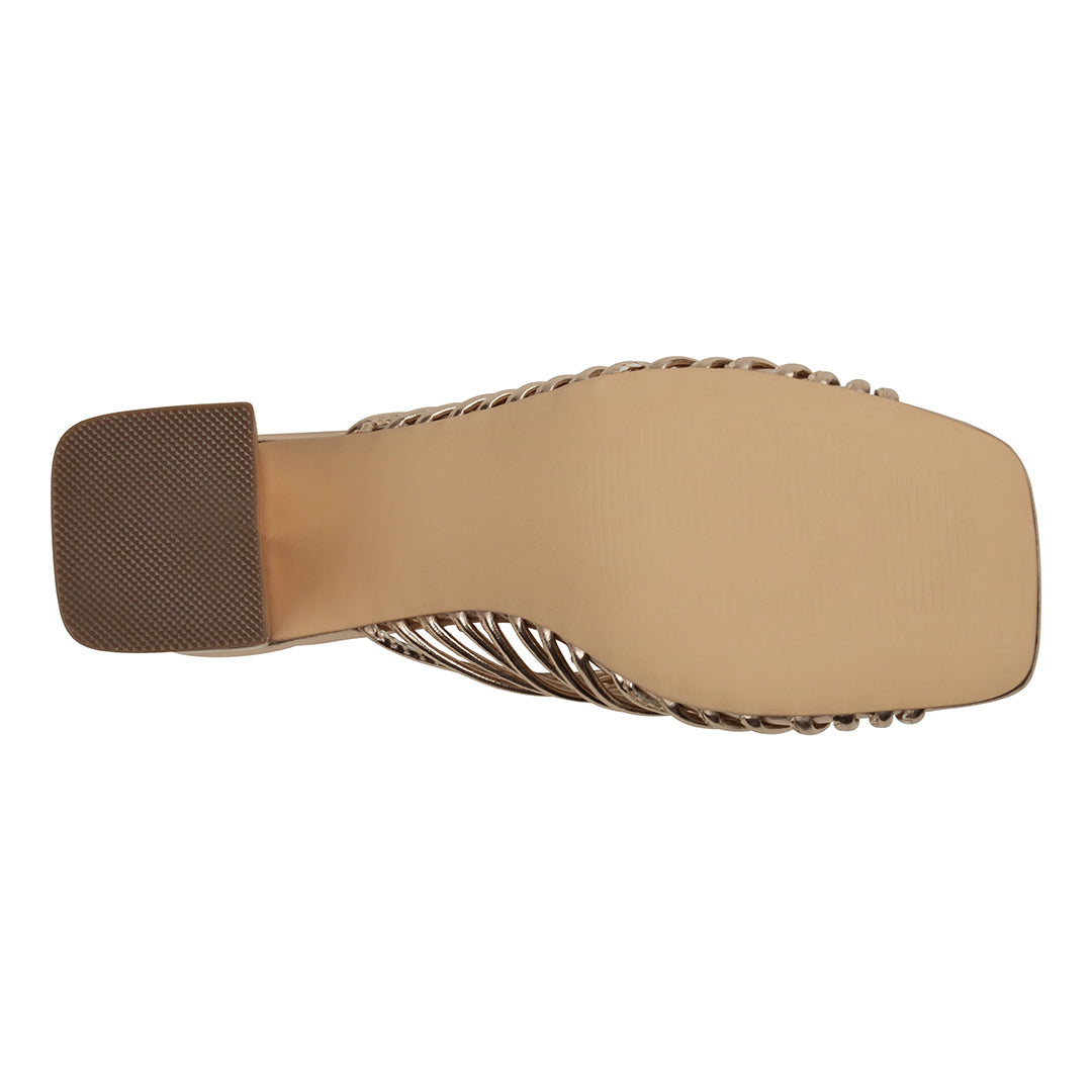 Beige sandal sole with brown heel on a white background