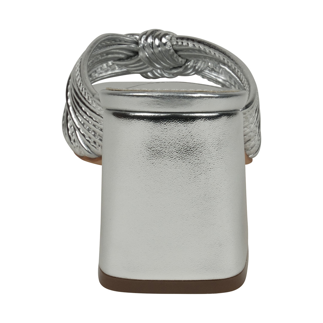 Silver ring with a textured band on a white background