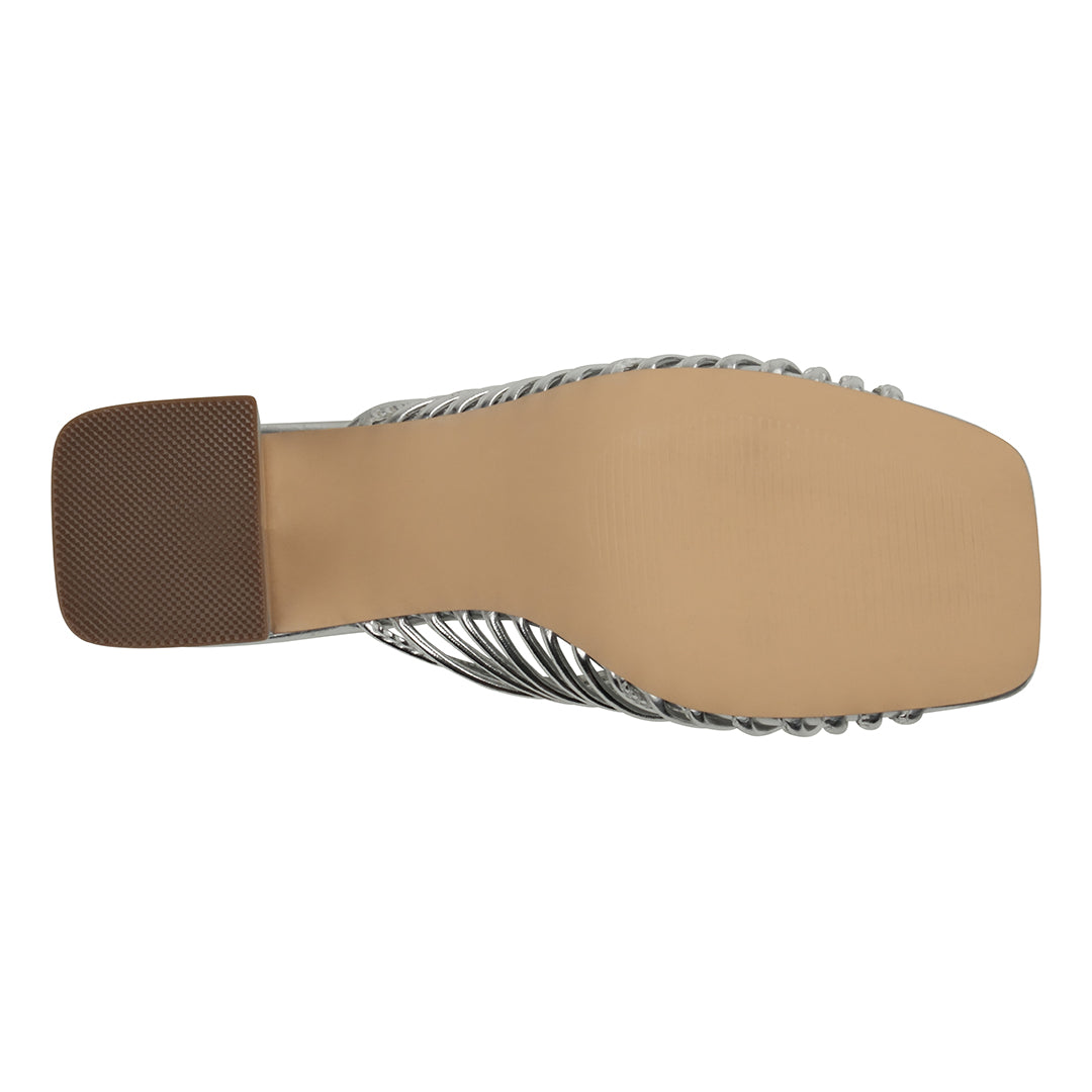 Close-up of a sandal sole with a brown insole on a white background