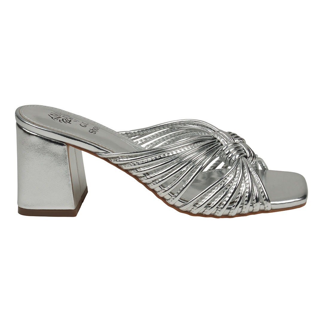 Silver high-heeled sandal on a white background