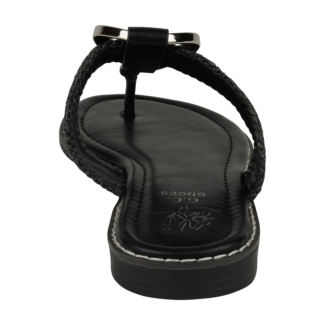 Black sandal with a bow on a white background