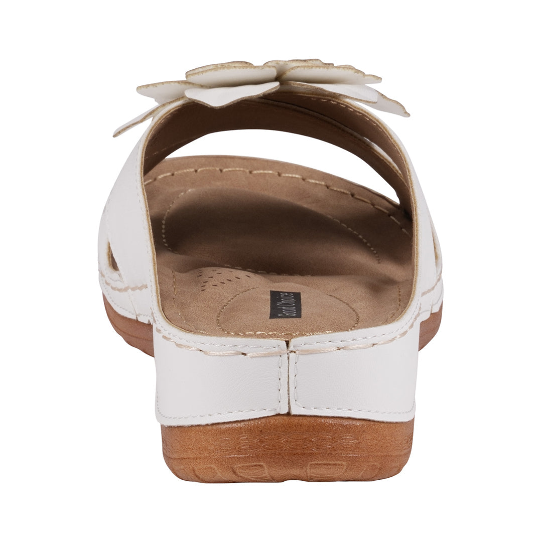 White sandal with brown sole on a white background