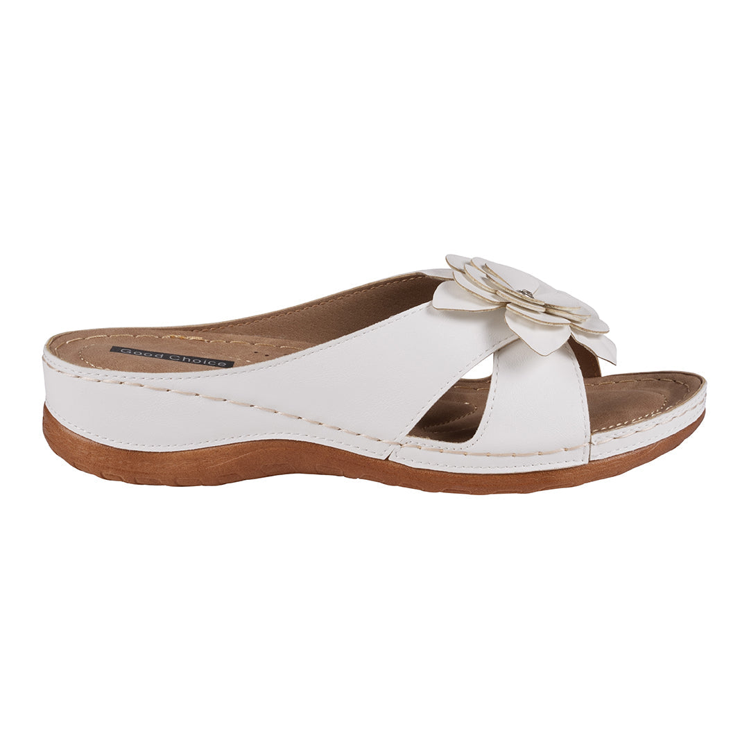 White sandal with a flower detail on a white background