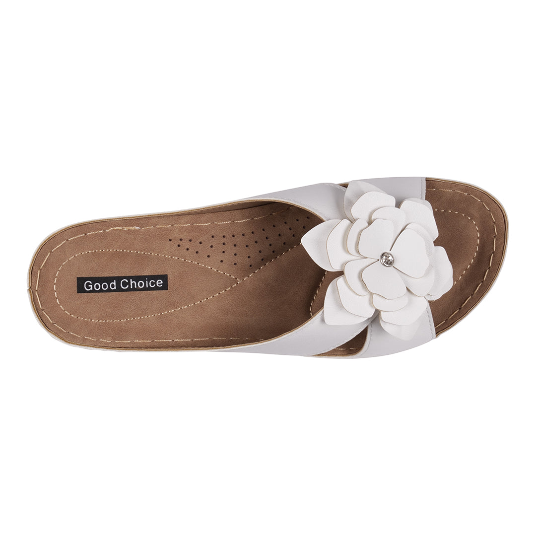 Brown sandal with a white flower design on a white background