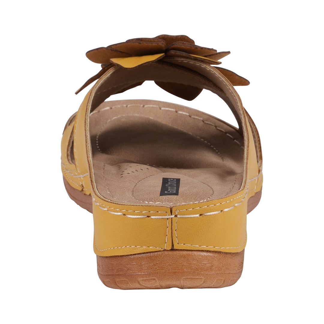 Yellow sandal with a brown bow on a white background
