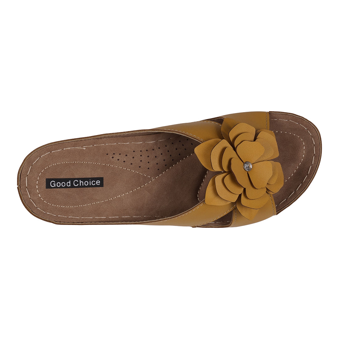 Brown sandal with yellow flower detail on a white background