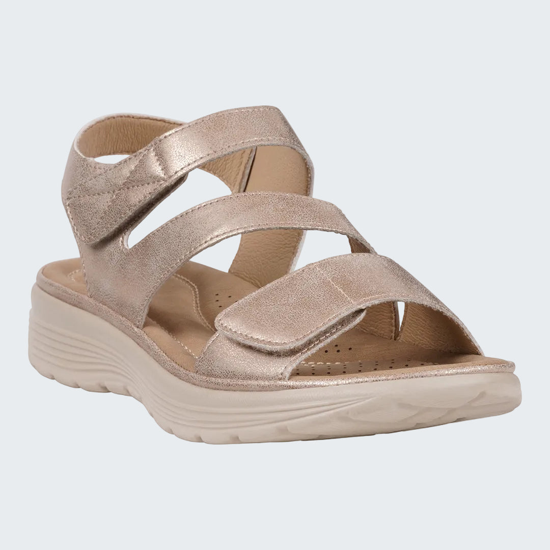 Beige sandal with multiple straps on a white background
