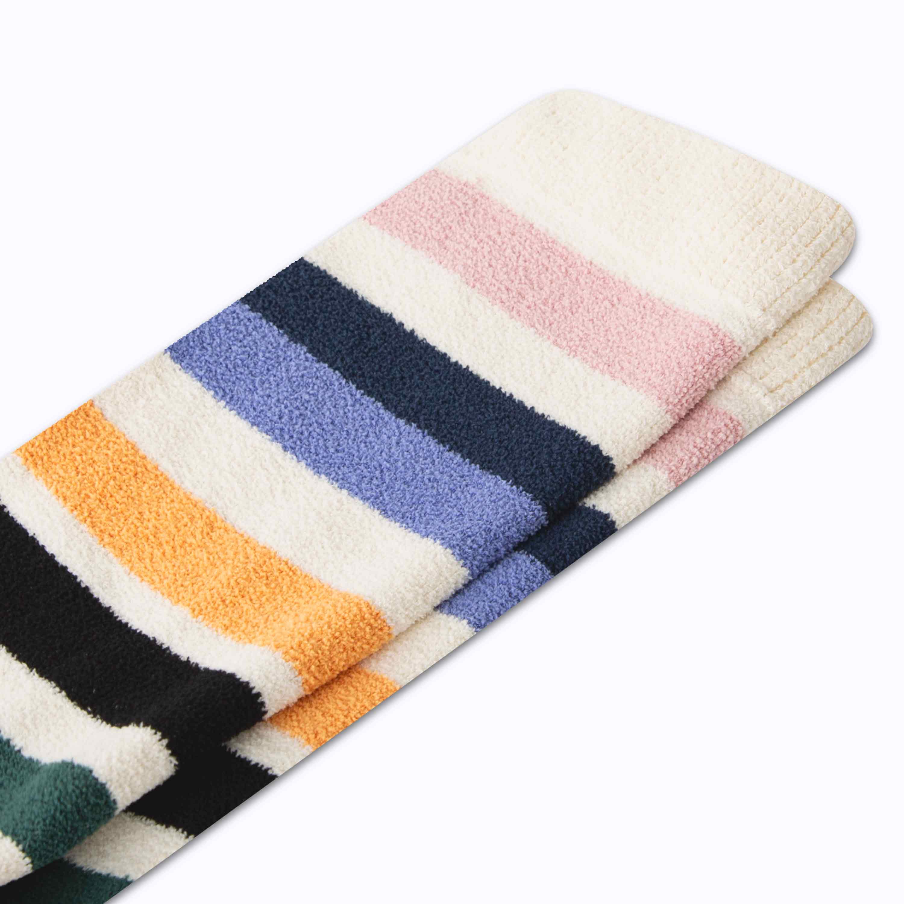 Stack of colorful striped towels on a white background