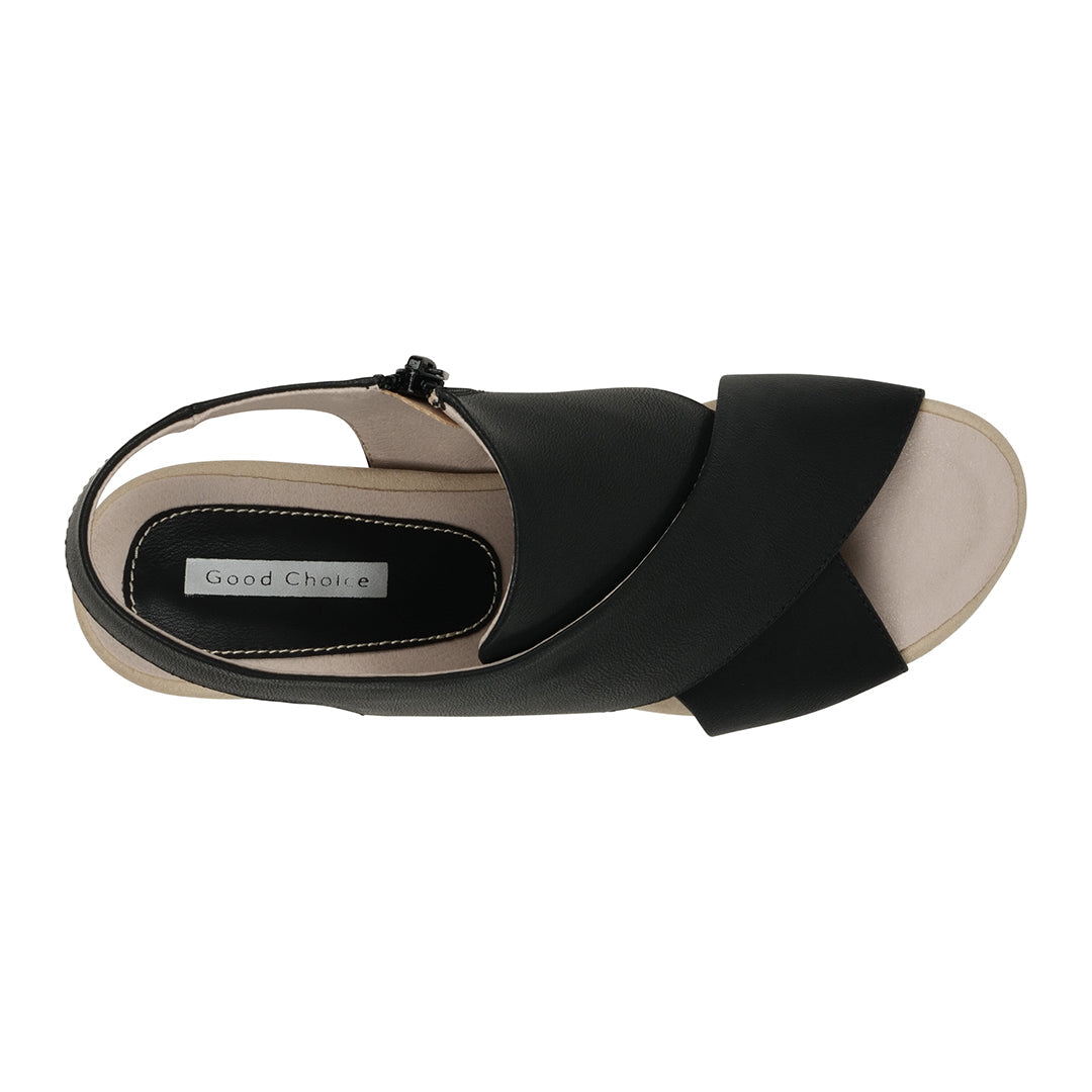 Black sandal with beige sole on a white background
