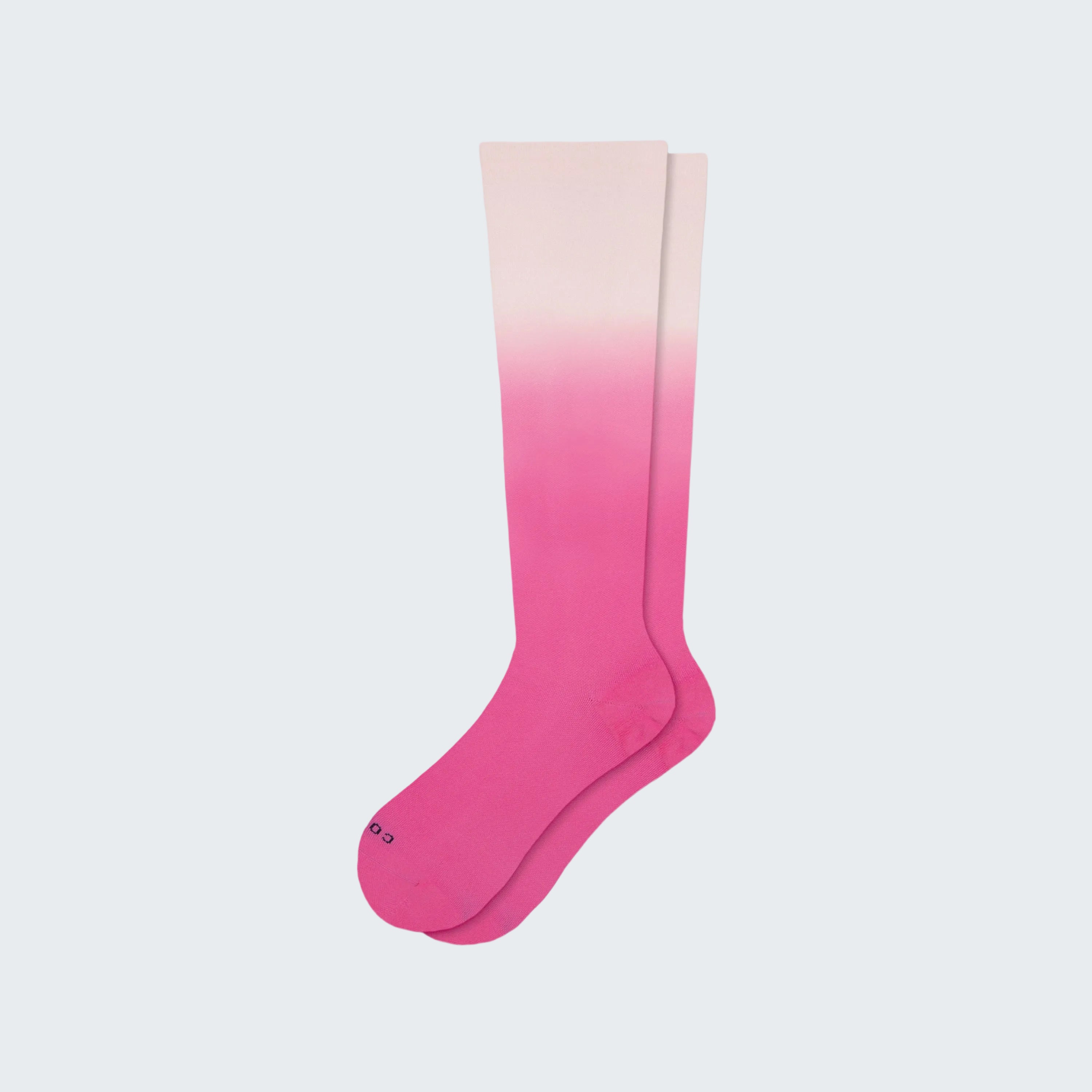 Knee-high sock with pink to beige gradient on a white background