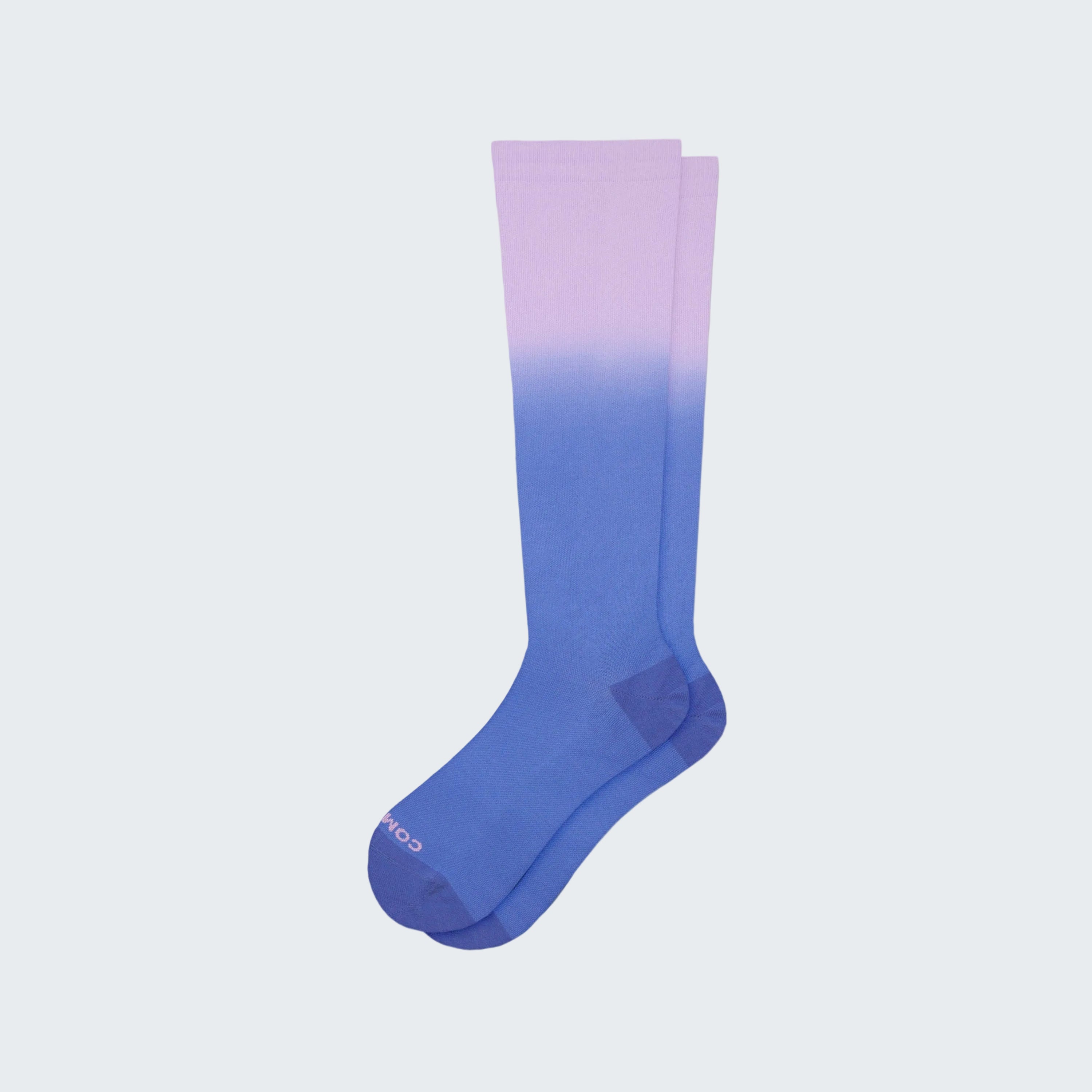 Knee-high sock with gradient color from purple to blue on a white background