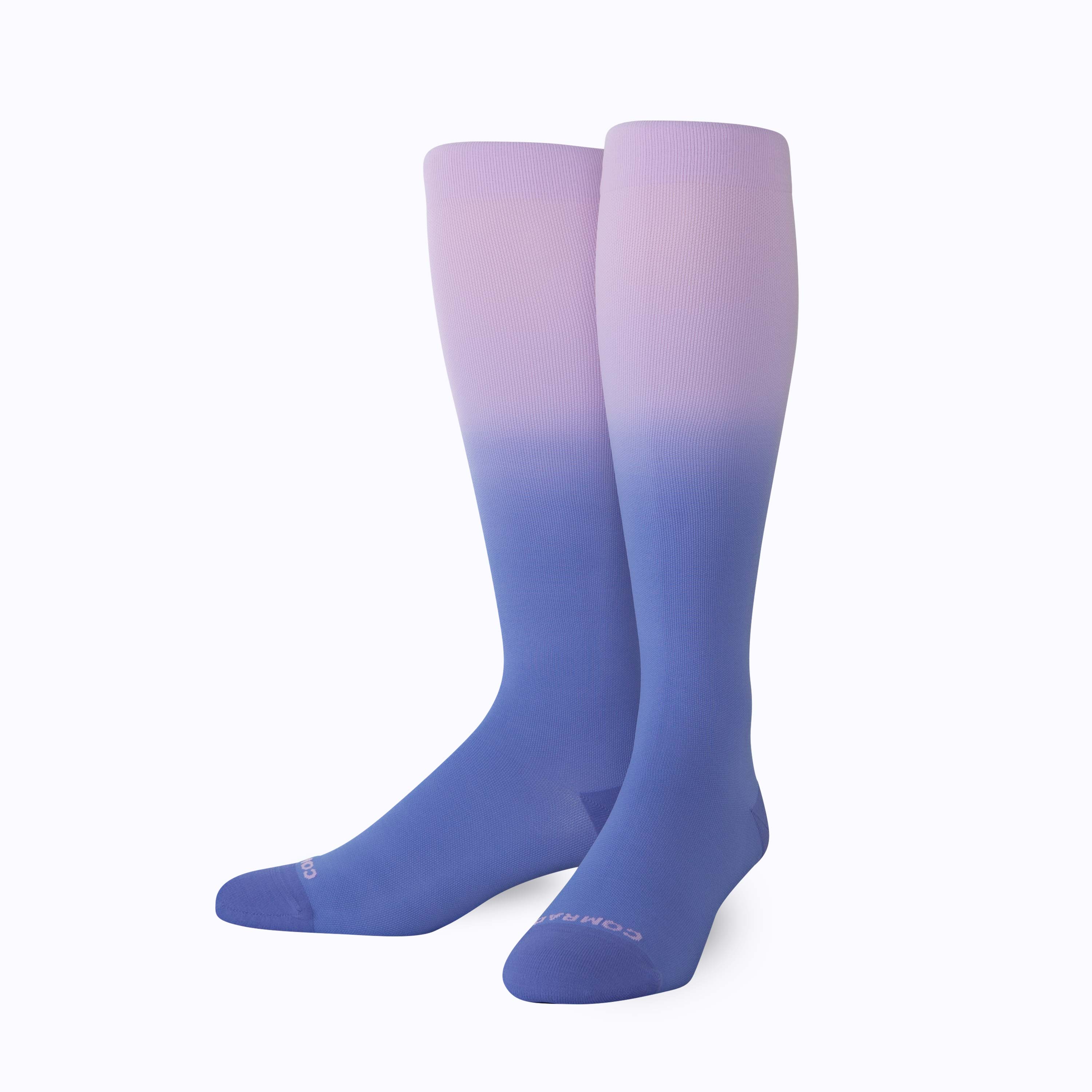 Pair of purple and blue gradient knee-high socks on a white background
