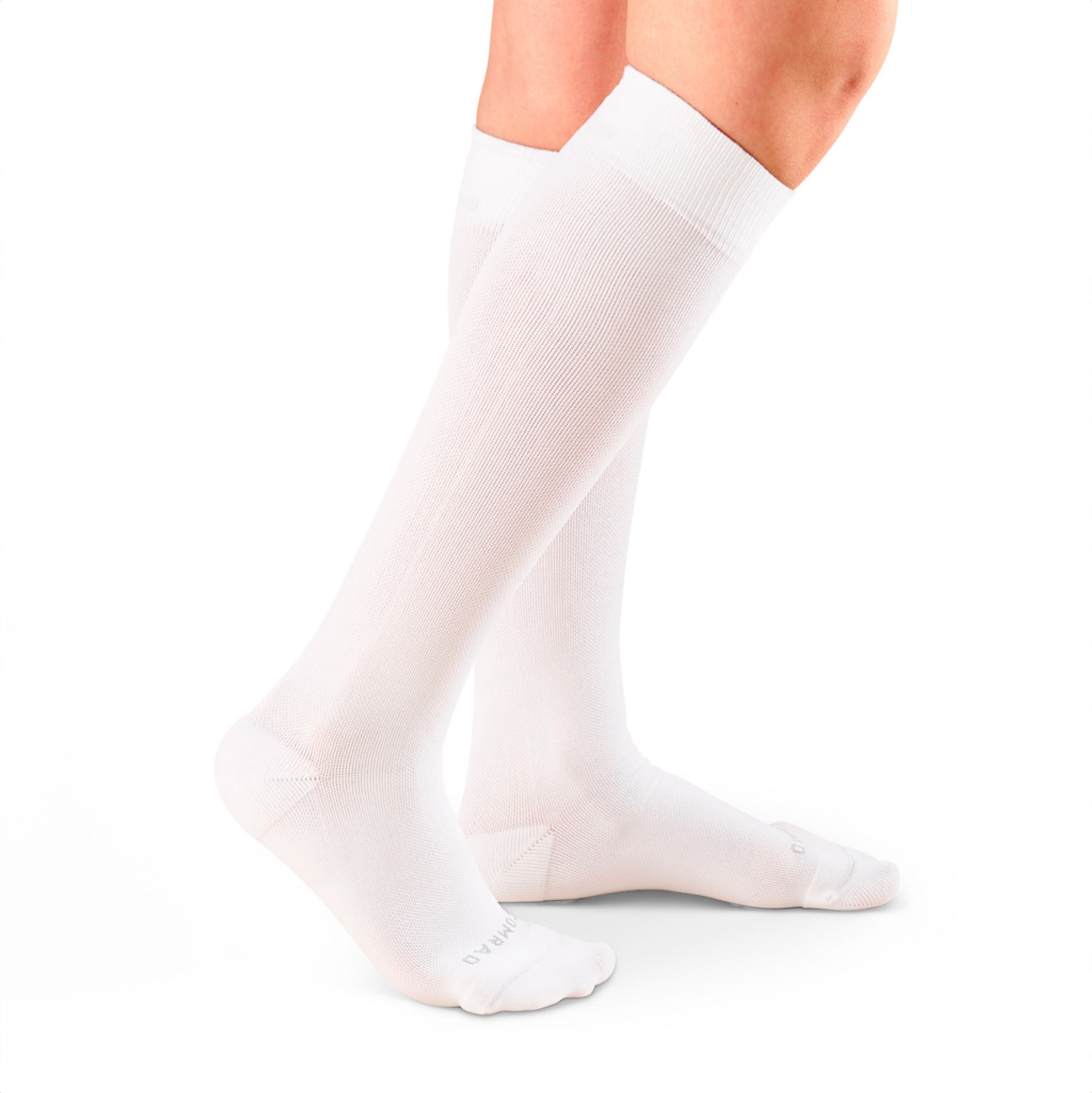 White knee-high socks worn by a person on a white background
