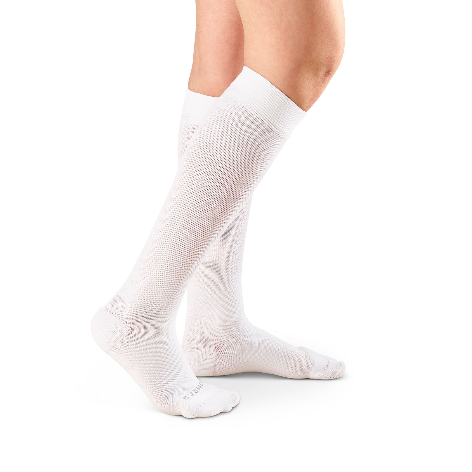White knee-high socks worn by a person on a white background