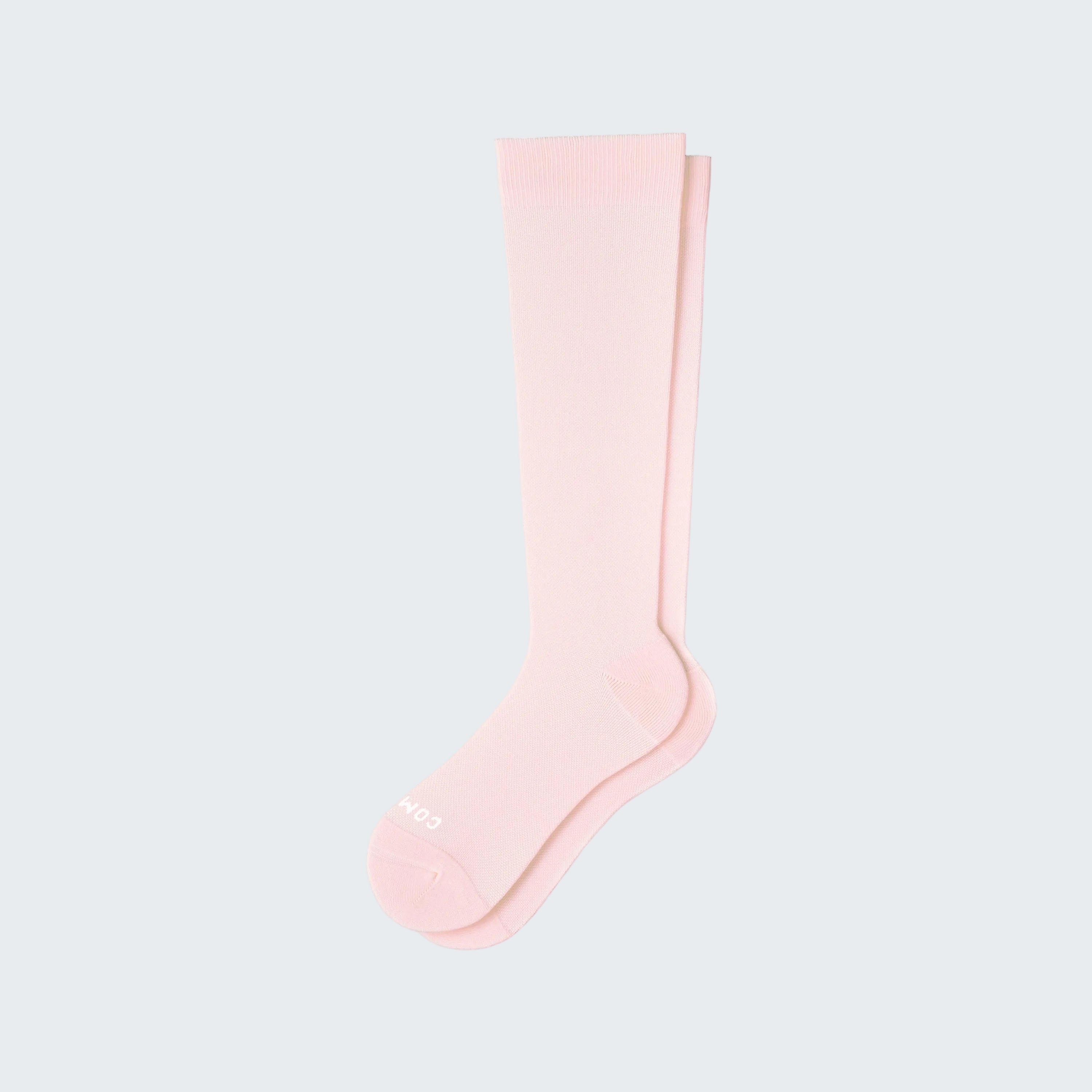 Pink knee-high sock on a white background