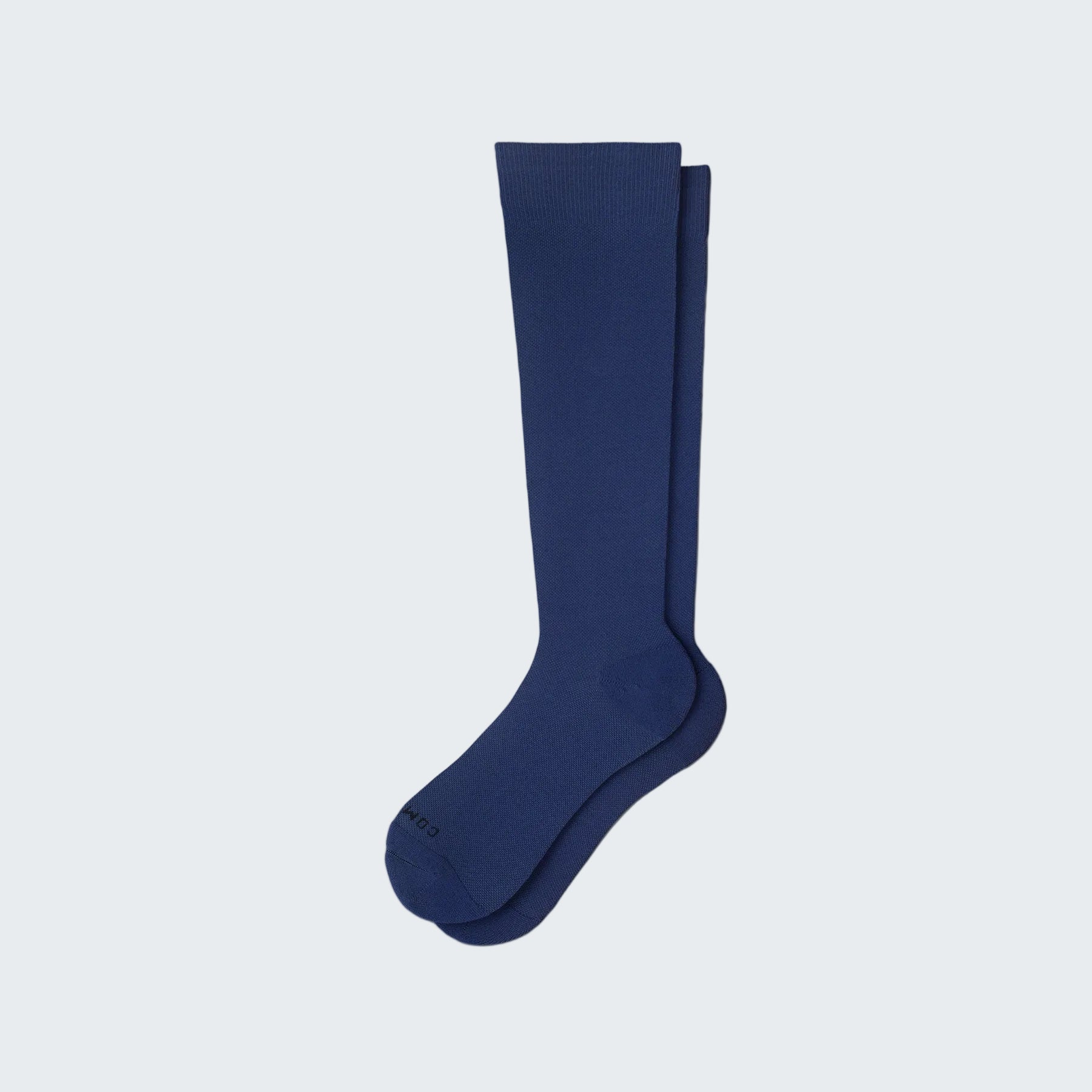 Navy blue knee-high sock on a white background
