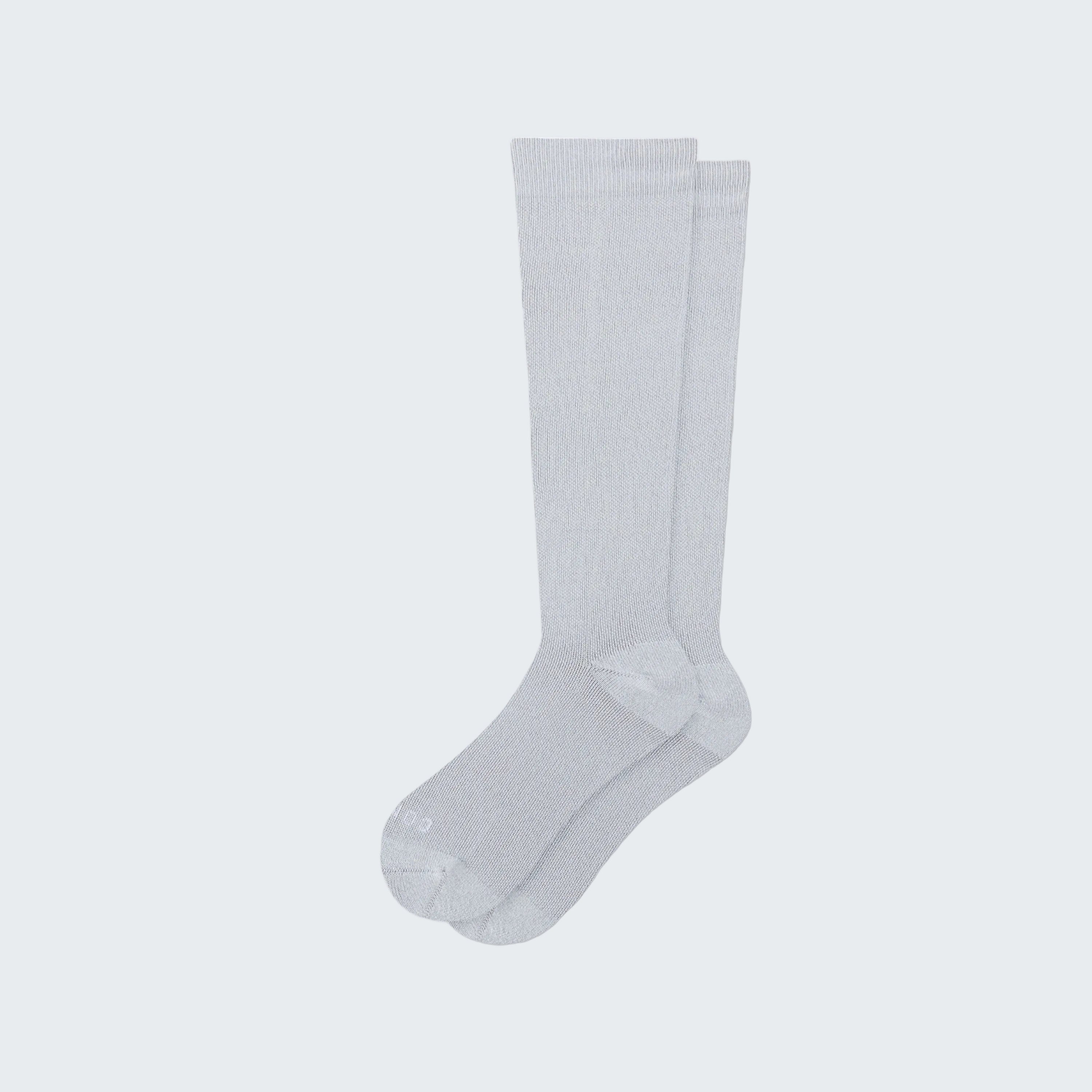 White knee-high socks on a white background