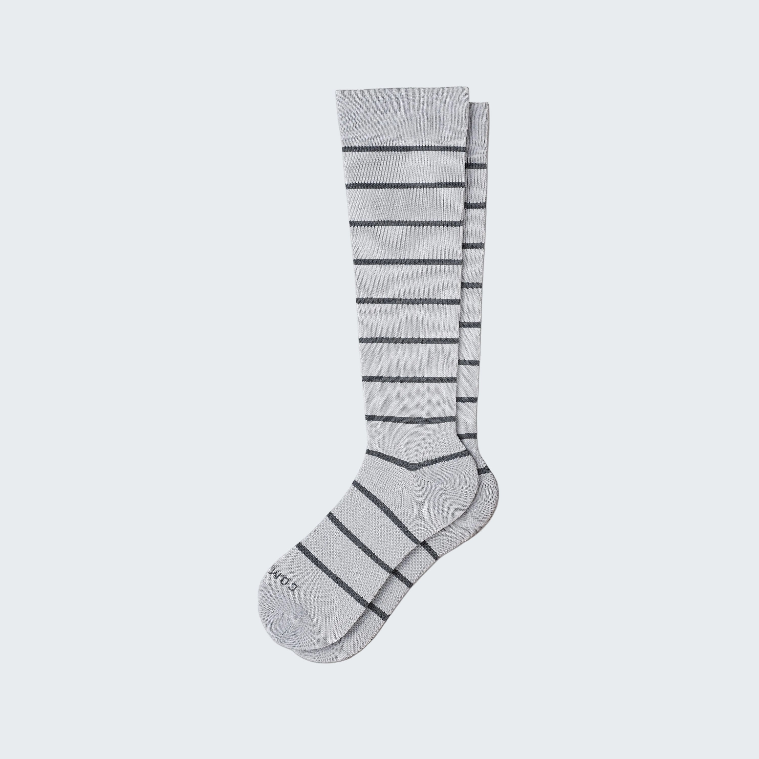 Gray knee-high sock with horizontal stripes on a white background