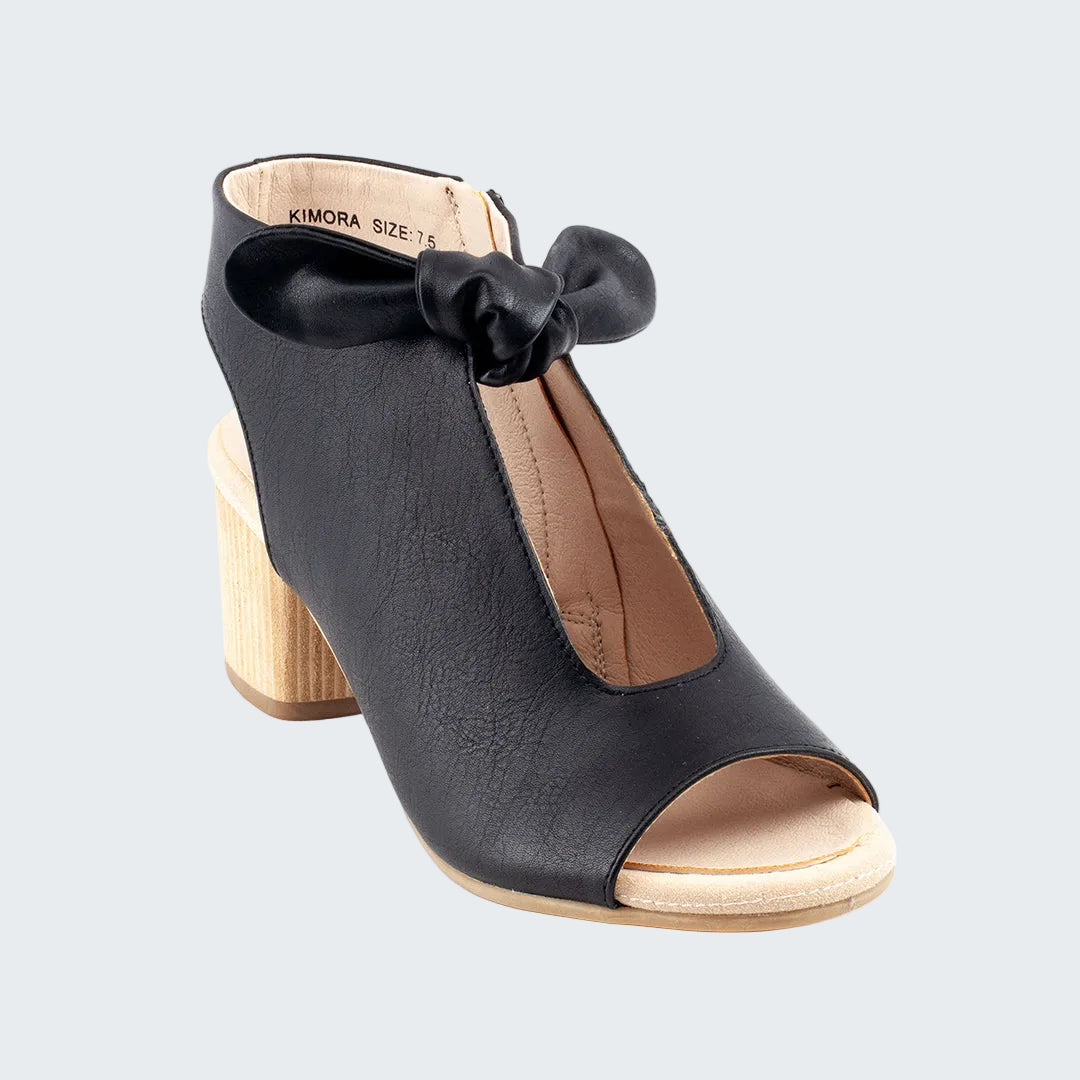 Black sandal with a bow on a white background