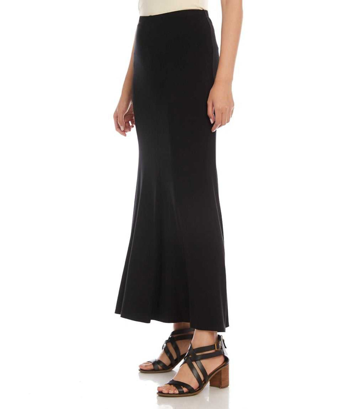 A model wearing a black high-waisted, flared midi skirt paired with black strappy heeled sandals, shown from the waist down on a white studio background.