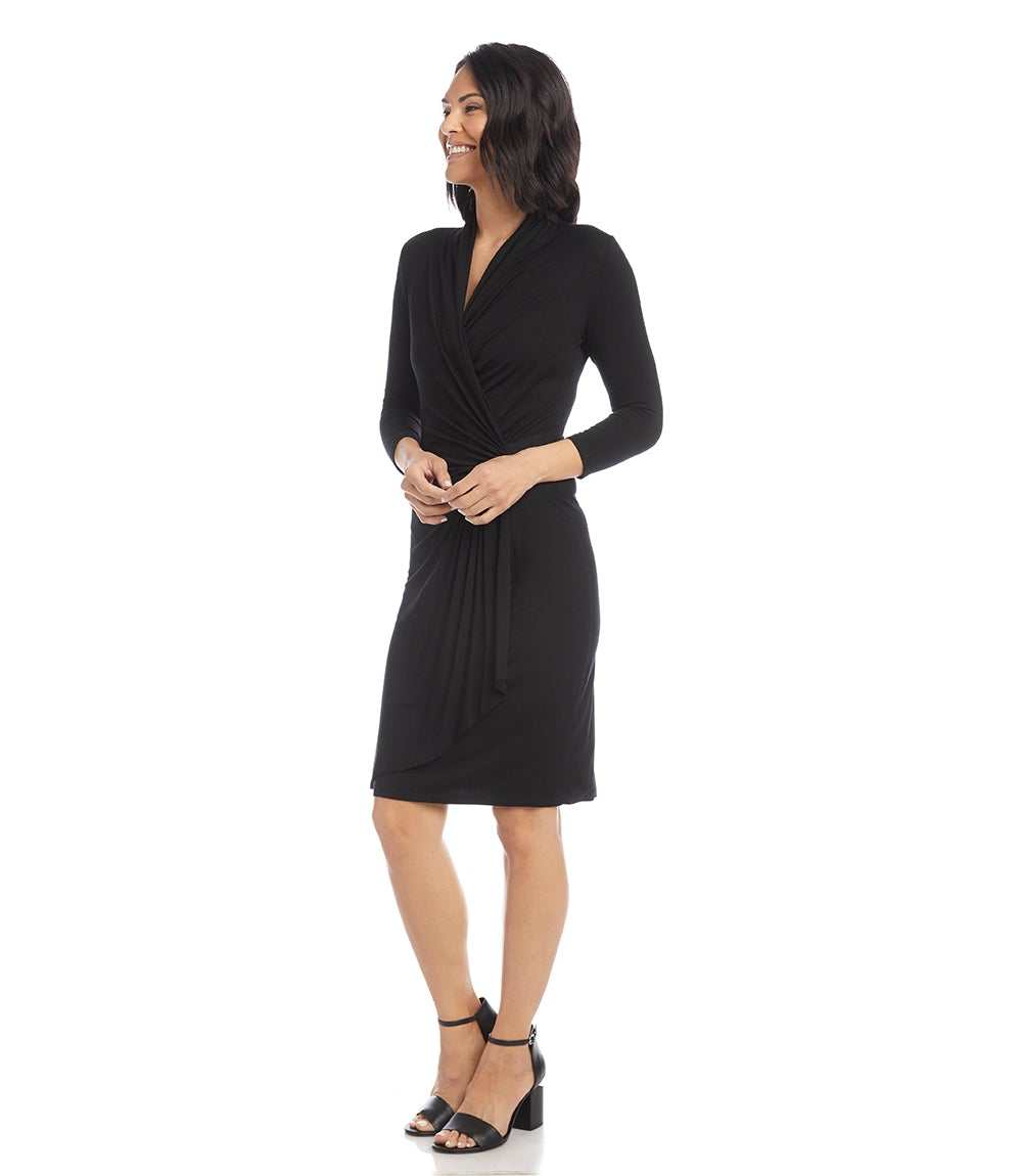Woman wearing a black dress on a white background