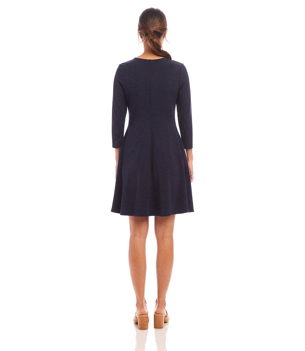 Navy blue dress worn by a model on a white background