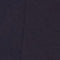 A close-up of a dark navy blue textured material, likely a fabric or leather surface.