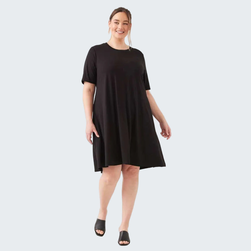 Woman wearing a black dress on a white background