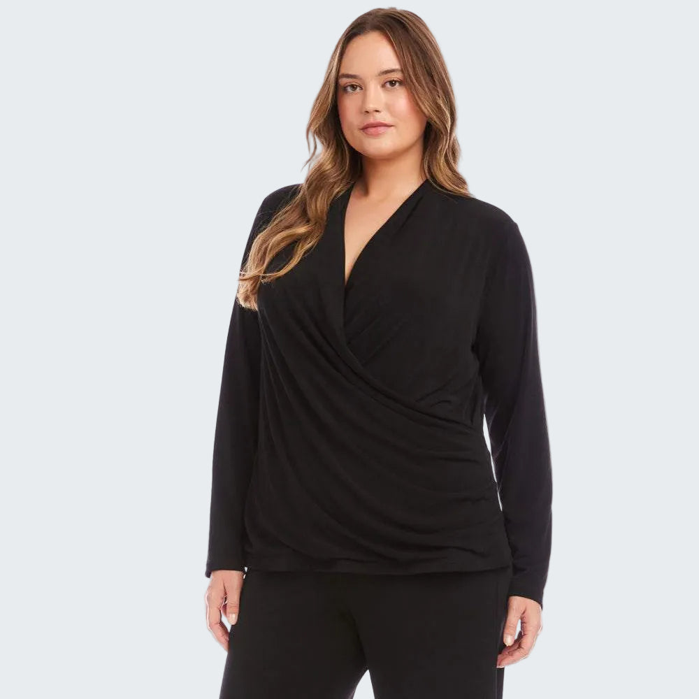 A woman modeling a black long-sleeve wrap-style top against a plain white background.