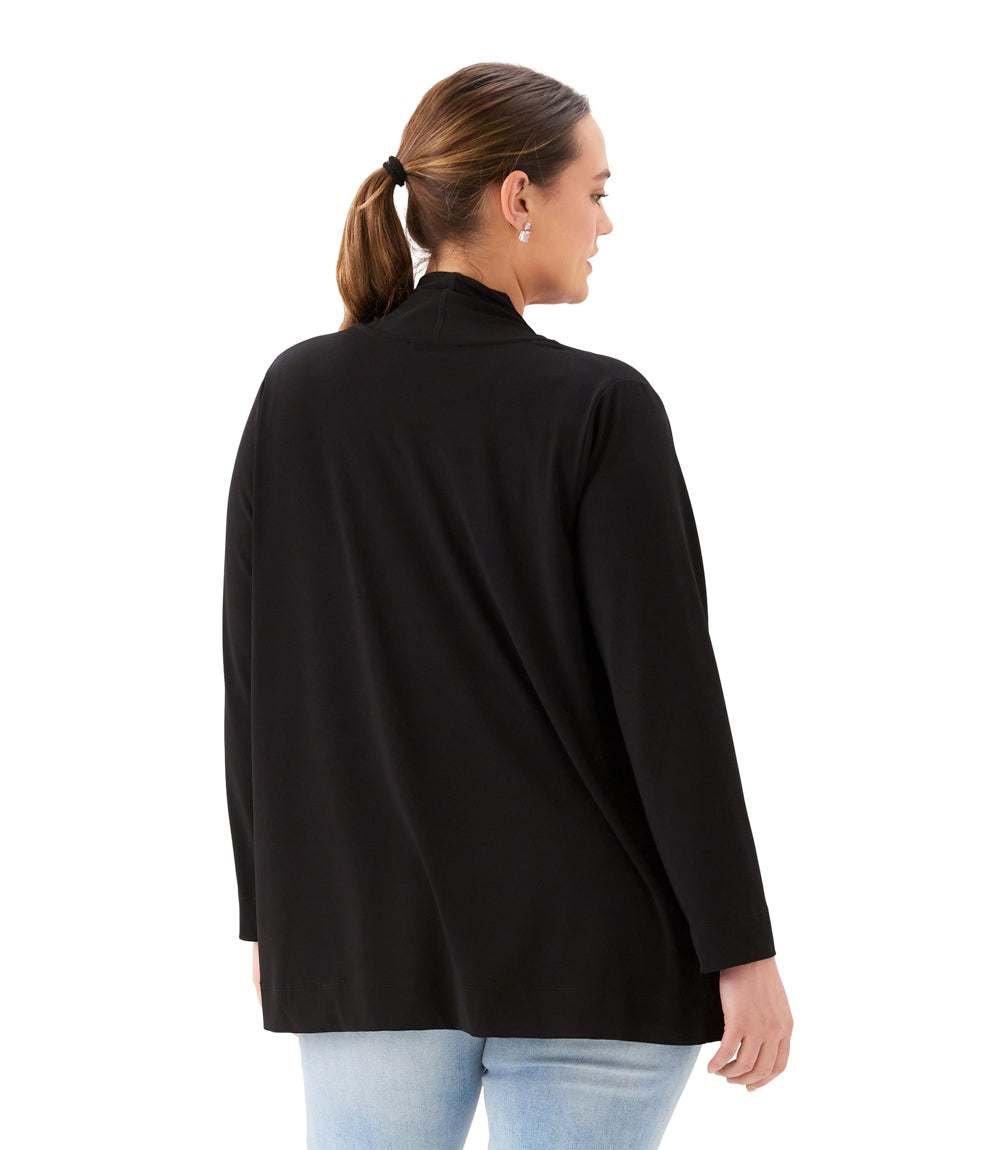 A woman shown from the back wearing a black long-sleeve mock neck top and light blue jeans against a plain white background.