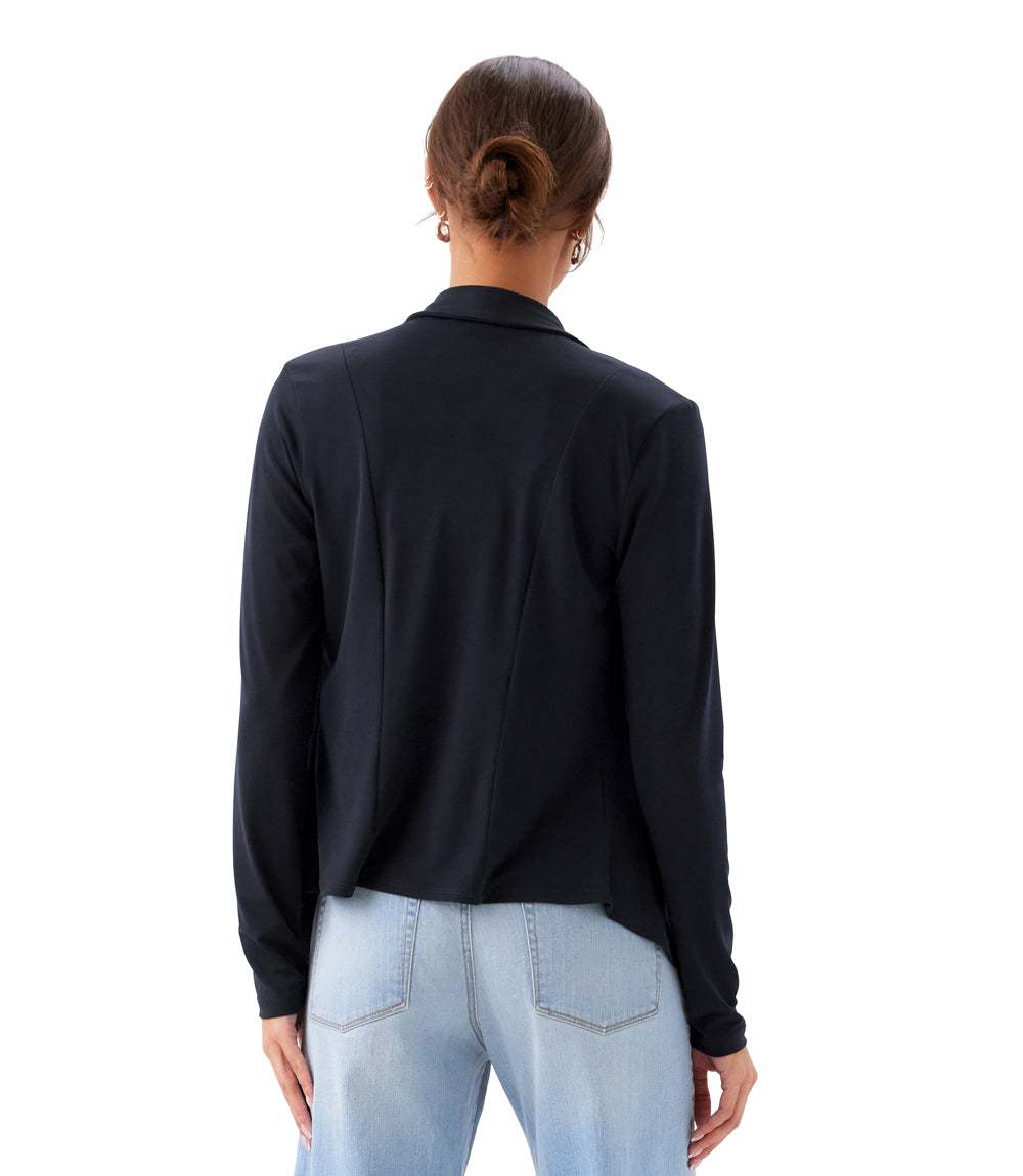 Person wearing a black shirt and light blue jeans on a white background