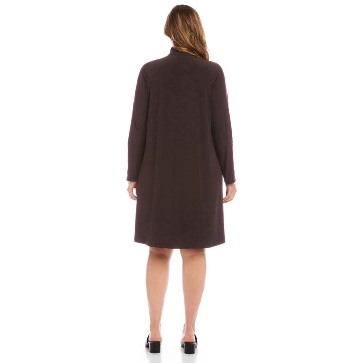 A woman viewed from the back wearing a dark brown long-sleeve knee-length coat or dress against a plain white studio background.