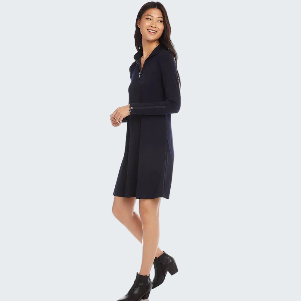 Woman wearing a navy blue dress with a white background