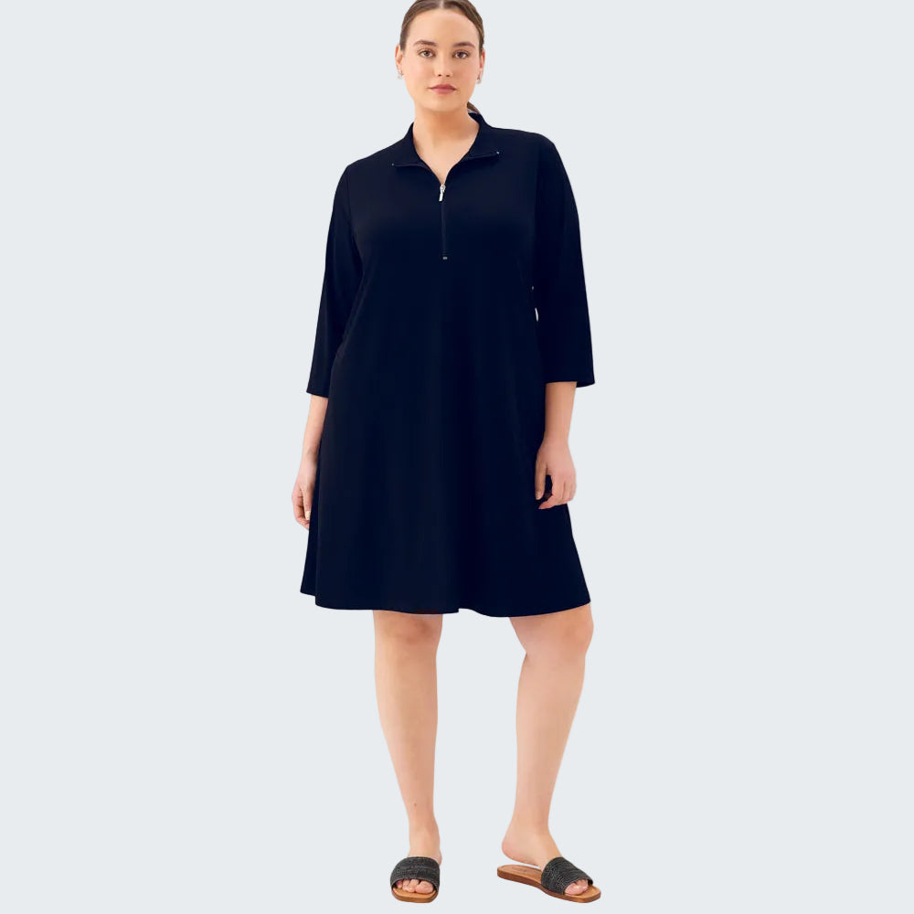 Woman wearing a navy blue dress on a white background