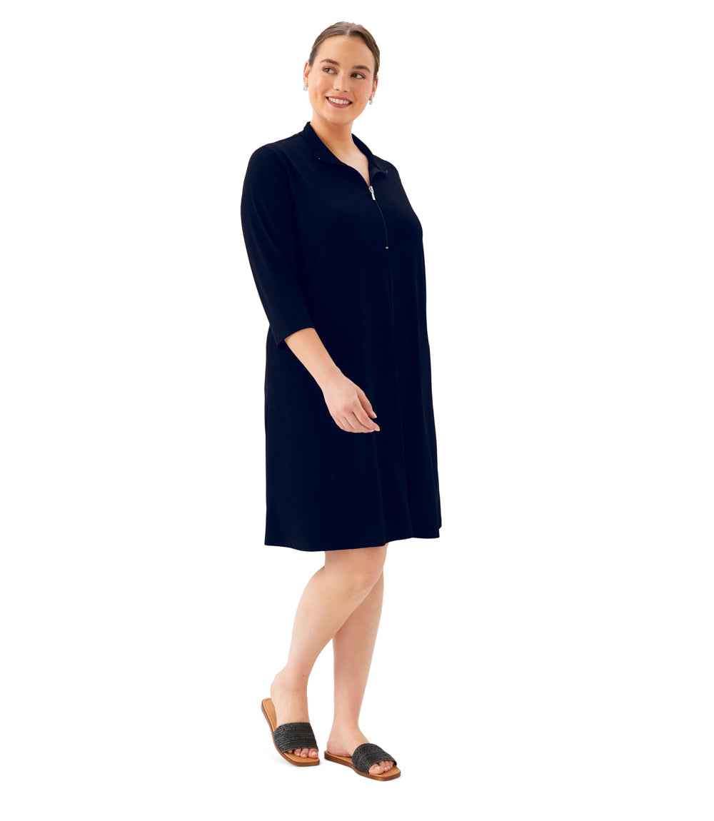 Woman wearing a navy blue dress on a white background